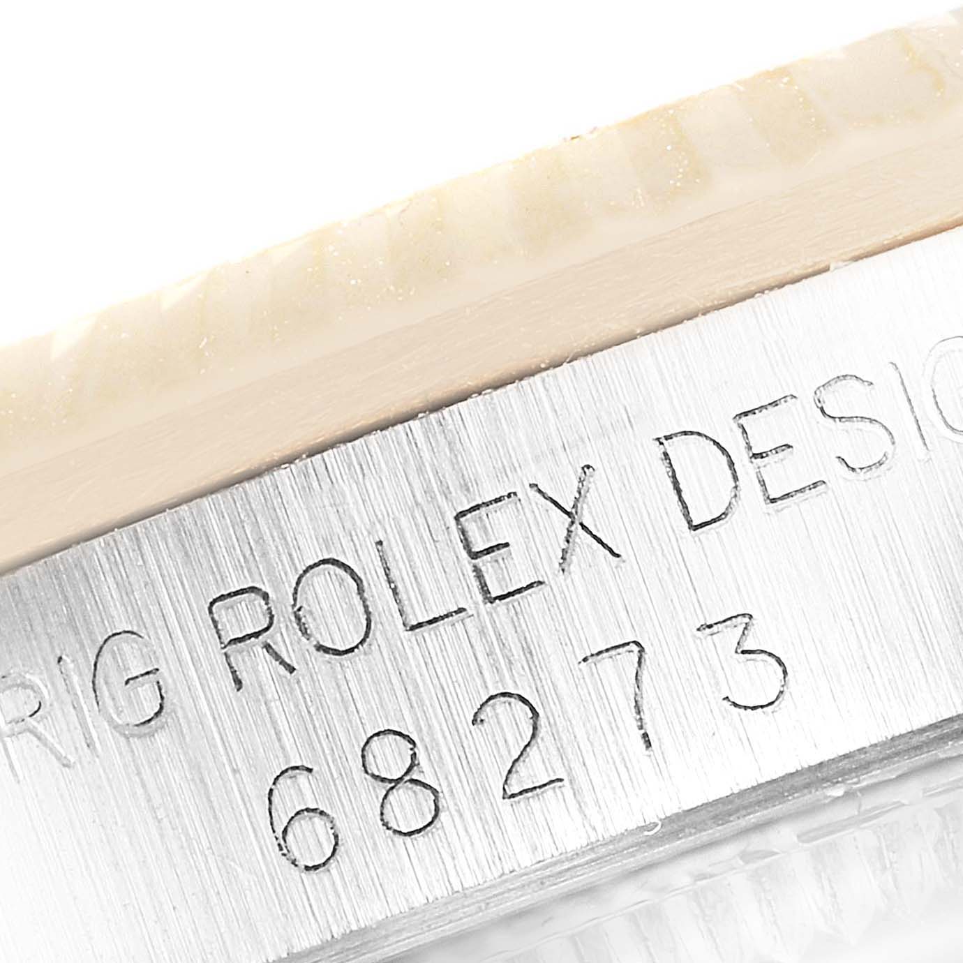 The image shows a close-up of the side engraving and bezel of a mid-size Rolex model 68273.