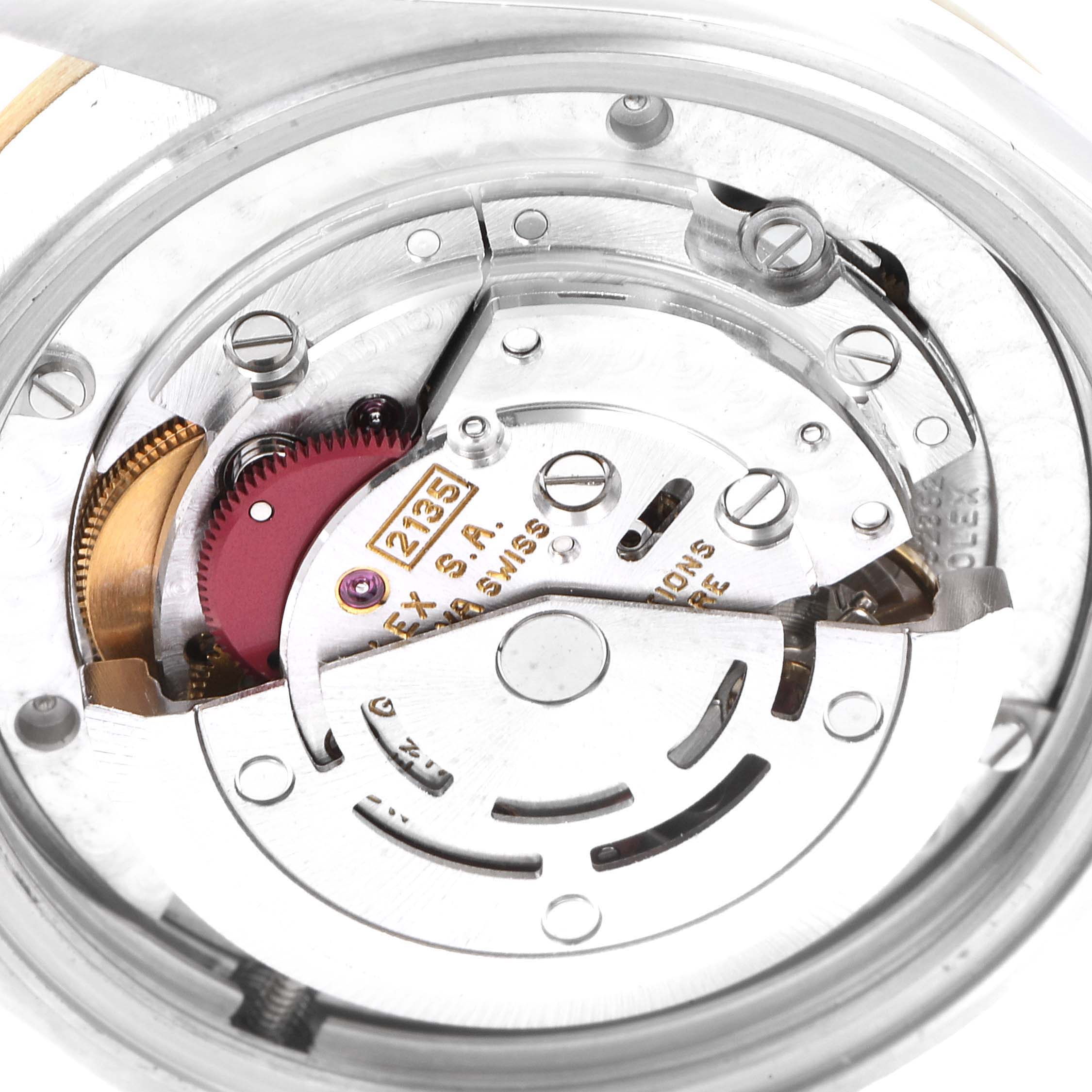 This image shows a close-up of the movement mechanism inside a mid-size Rolex watch model.