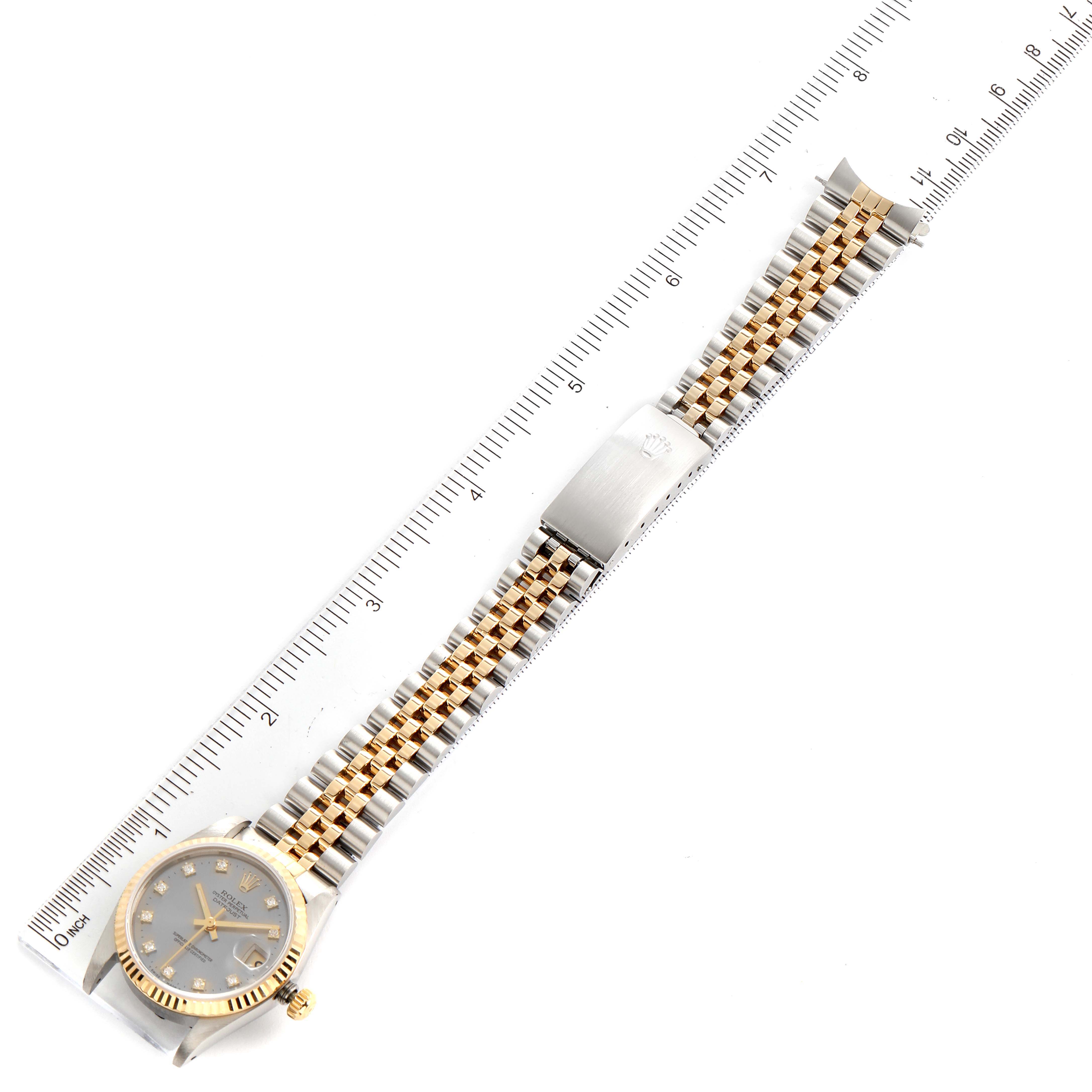 The Rolex Mid-Size 68273 Women's Steel and Gold (two tone) Grey Dial 68273 Women's Steel and Gold (two tone) Grey Dial model watch is shown from a top-down angle, displaying the entire bracelet, clasp, and face.
