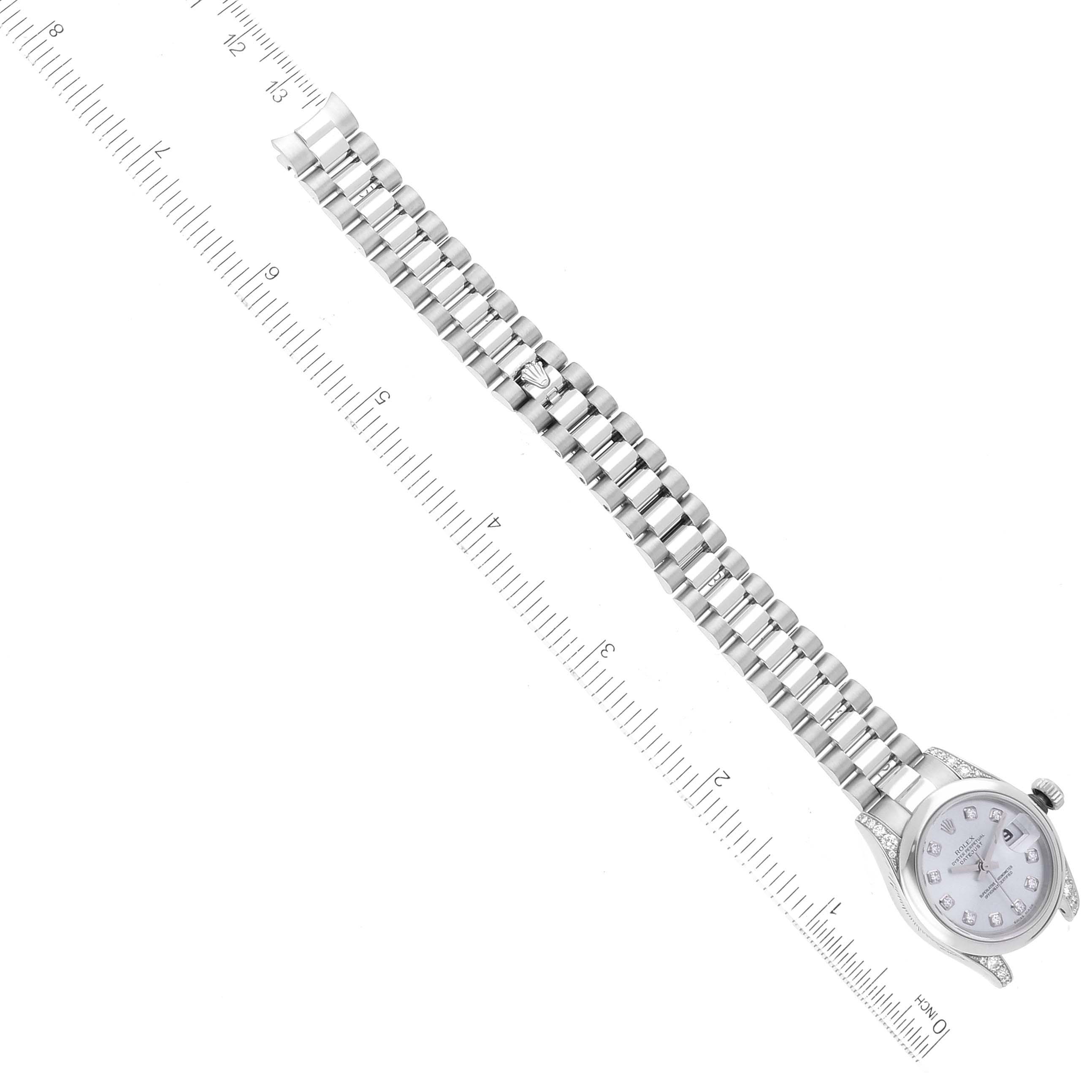 This image shows a top view of a Rolex President 179296 Women's Platinum Silver Dial 179296 Women's Platinum Silver Dial model watch, focusing on its bracelet and face alongside a measuring ruler.