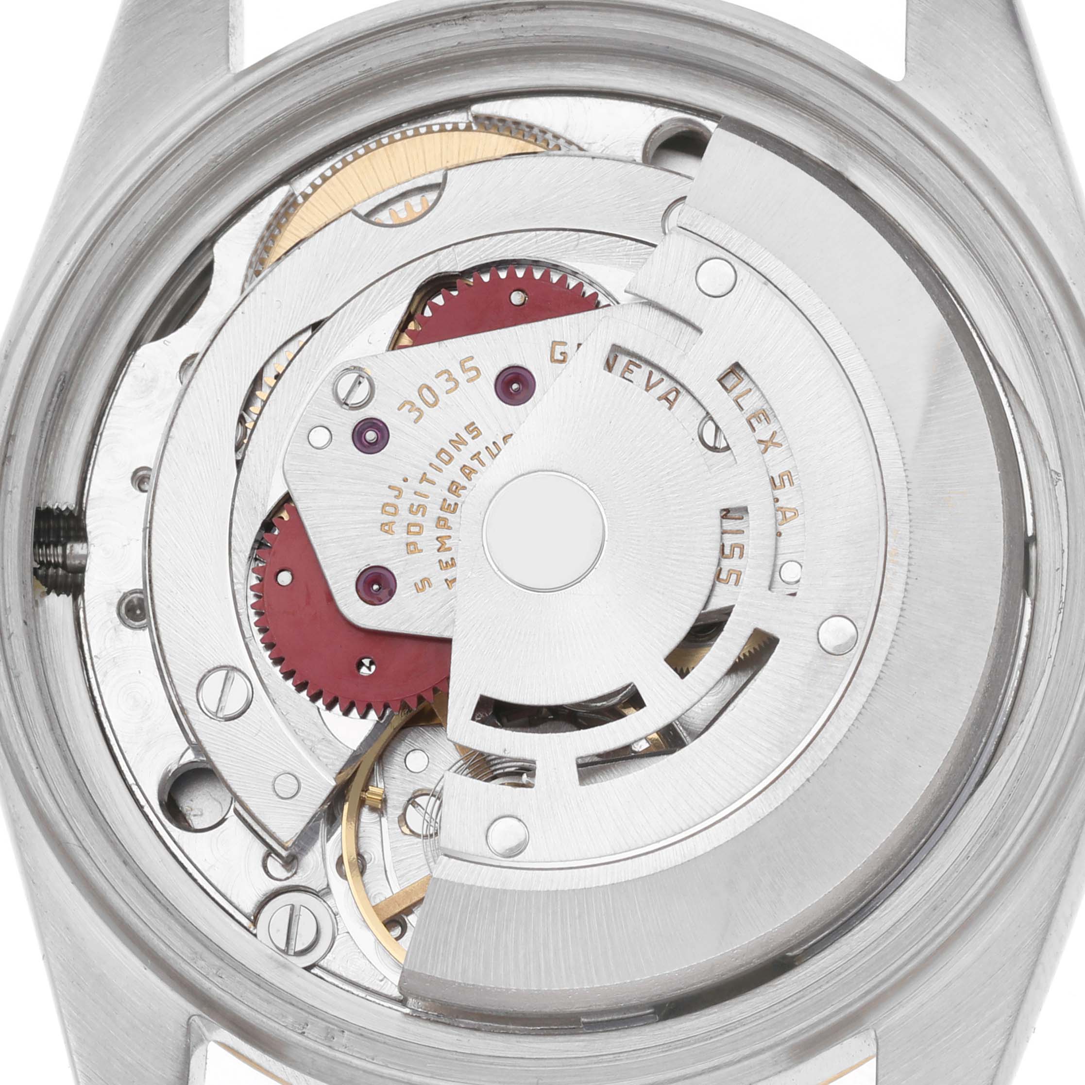 The image shows a close-up of the movement inside a Rolex Datejust model 16013 men
s watch, highlighting the intricate gears and rotors.