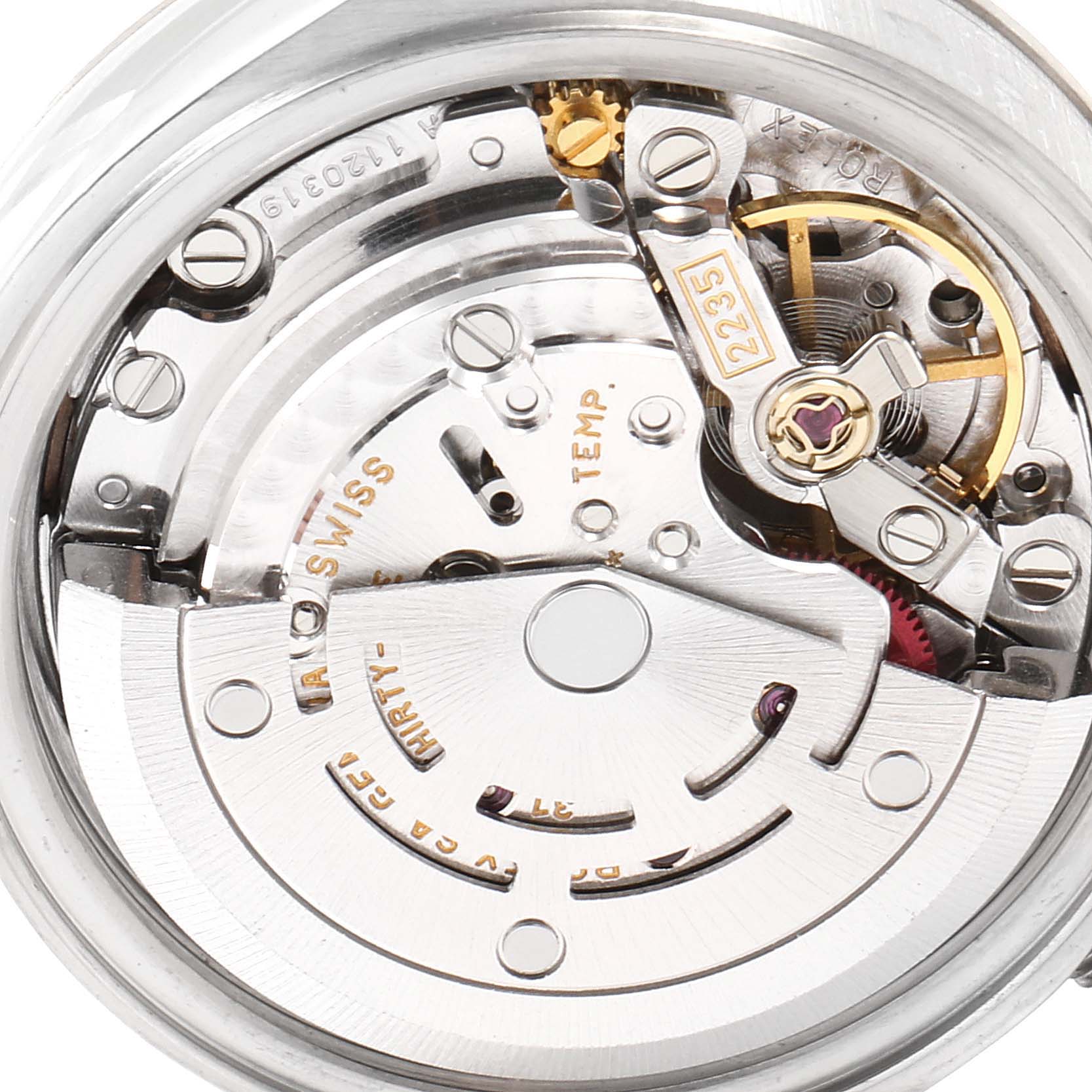 This image shows a close-up of the movement mechanism of a Rolex Datejust 79174 Women
s Stainless Steel Mother of Pearl Dial 79174 Women
s Stainless Steel Mother of Pearl Dial watch, highlighting gears and inscriptions.