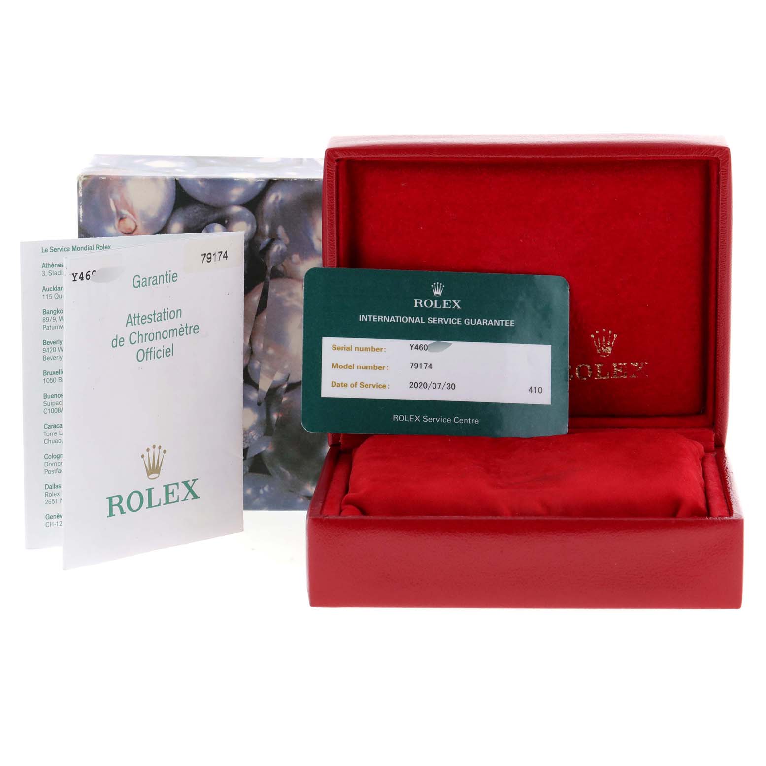 The image shows the accessories for a Rolex Datejust 79174 Women
s Stainless Steel Mother of Pearl Dial 79174 Women
s Stainless Steel Mother of Pearl Dial watch, including a red box, warranty card, and service guarantee card.
