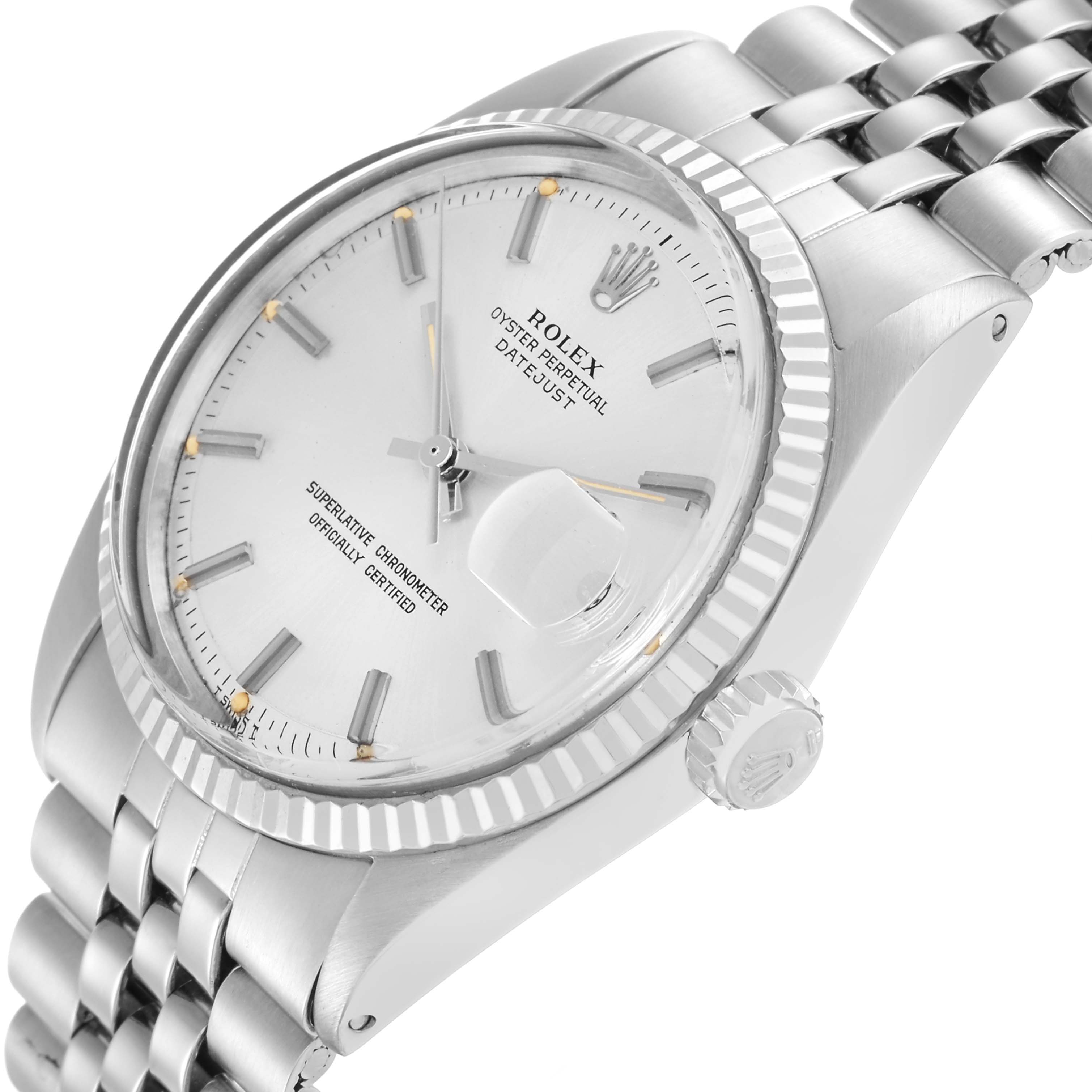 The Rolex Vintage Collection model 1601 watch is shown at an angle highlighting its fluted bezel, crown, and jubilee bracelet.