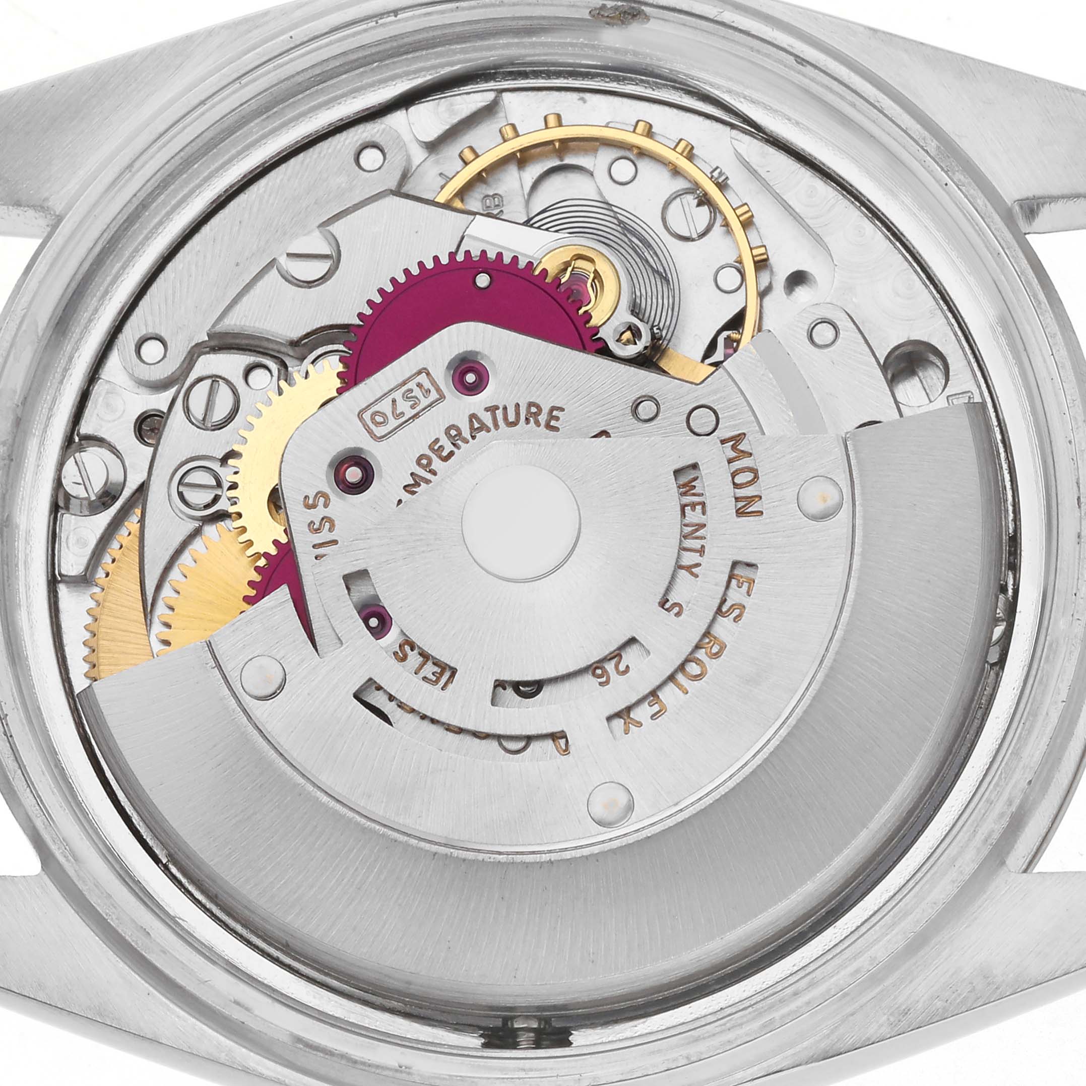 The image shows the movement mechanism of a Rolex Vintage Collection model, model number 1601, focusing on the gears and rotor from a rear angle.