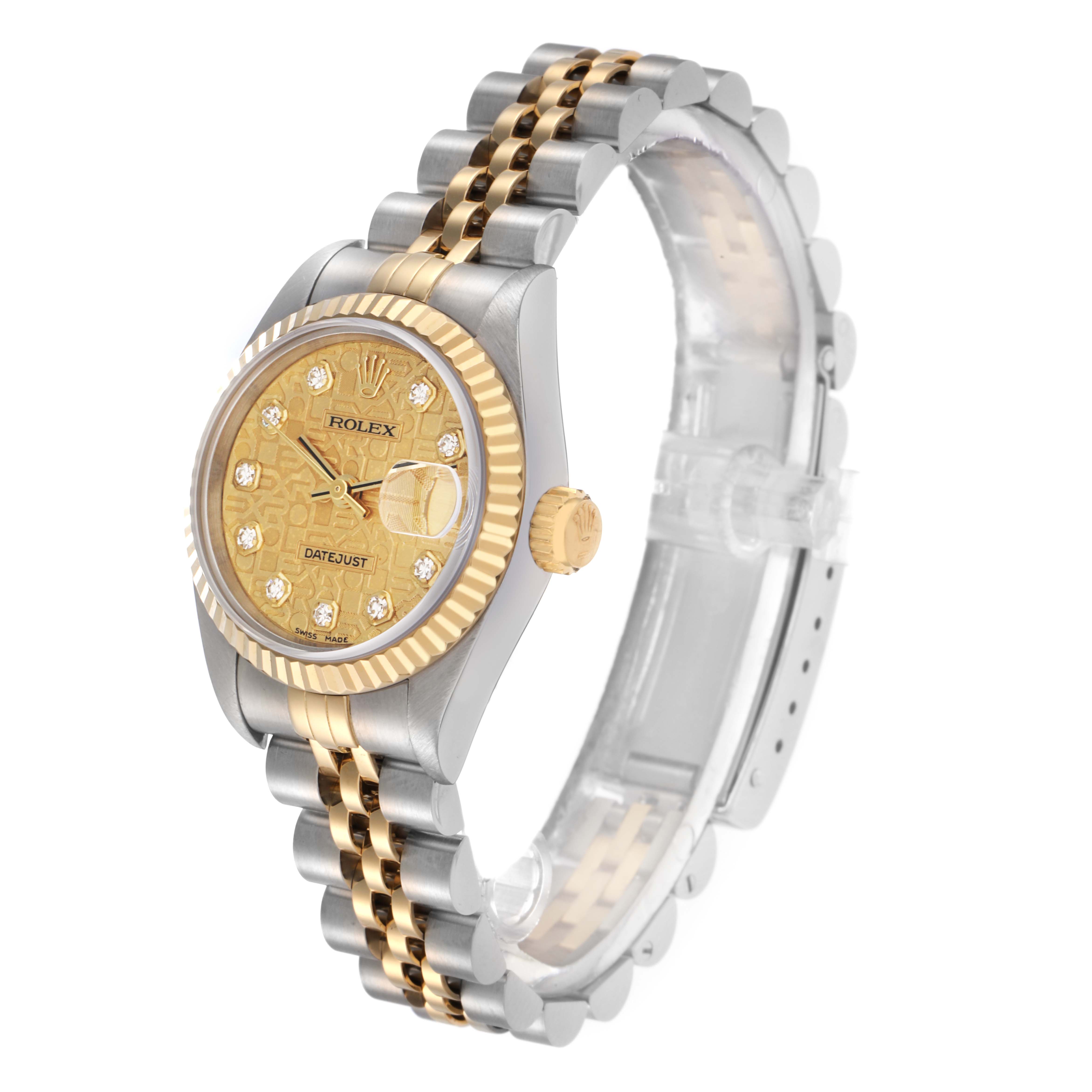 The Rolex Datejust model 79173 is shown from a three-quarter angle, highlighting the gold and silver jubilee bracelet, fluted bezel, and diamond hour markers.