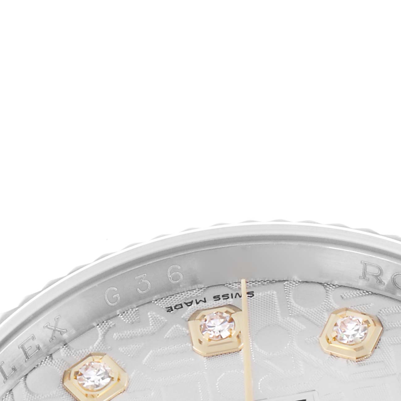 This image shows a close-up of the dial and bezel edge of a Rolex Datejust model 116233, highlighting the diamond markers and partial branding.
