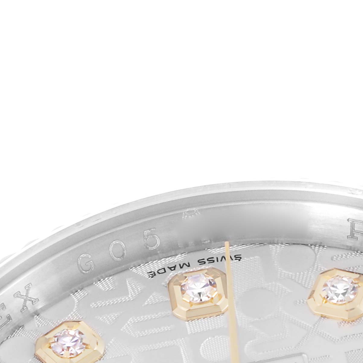 The image shows a close-up of the Rolex Datejust model 116233, focusing on the dial
s decorative elements and diamond hour markers viewed at a slight angle.