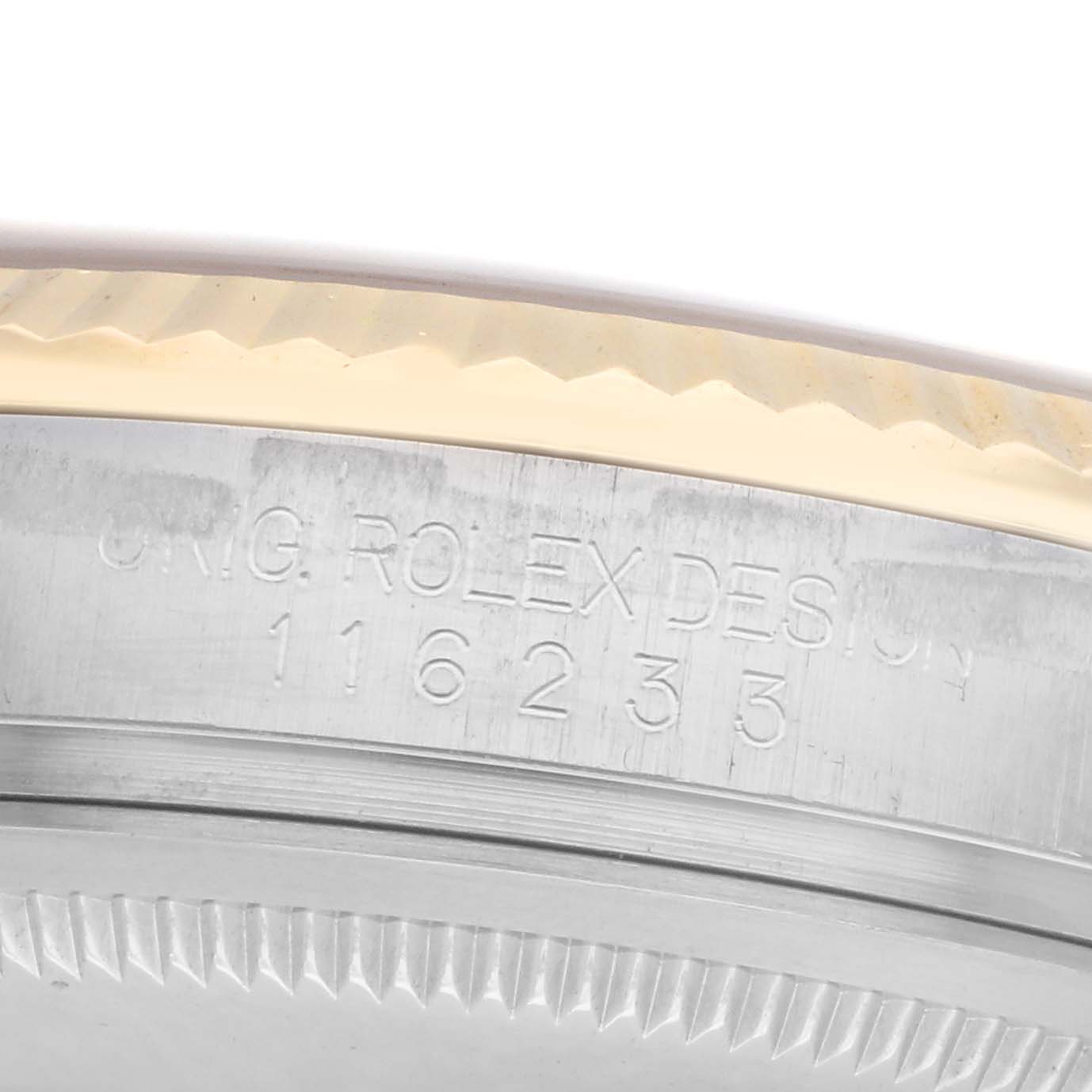 The image shows a close-up of the side engraving on the bezel of the Rolex Datejust model 116233, displaying the watch
s design details.