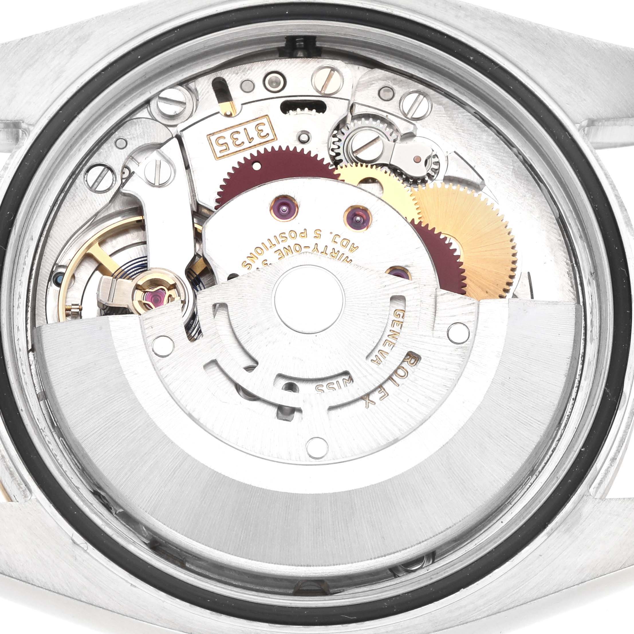 The image shows the back view of the Rolex Datejust model 116233, highlighting its movement and internal mechanical components.
