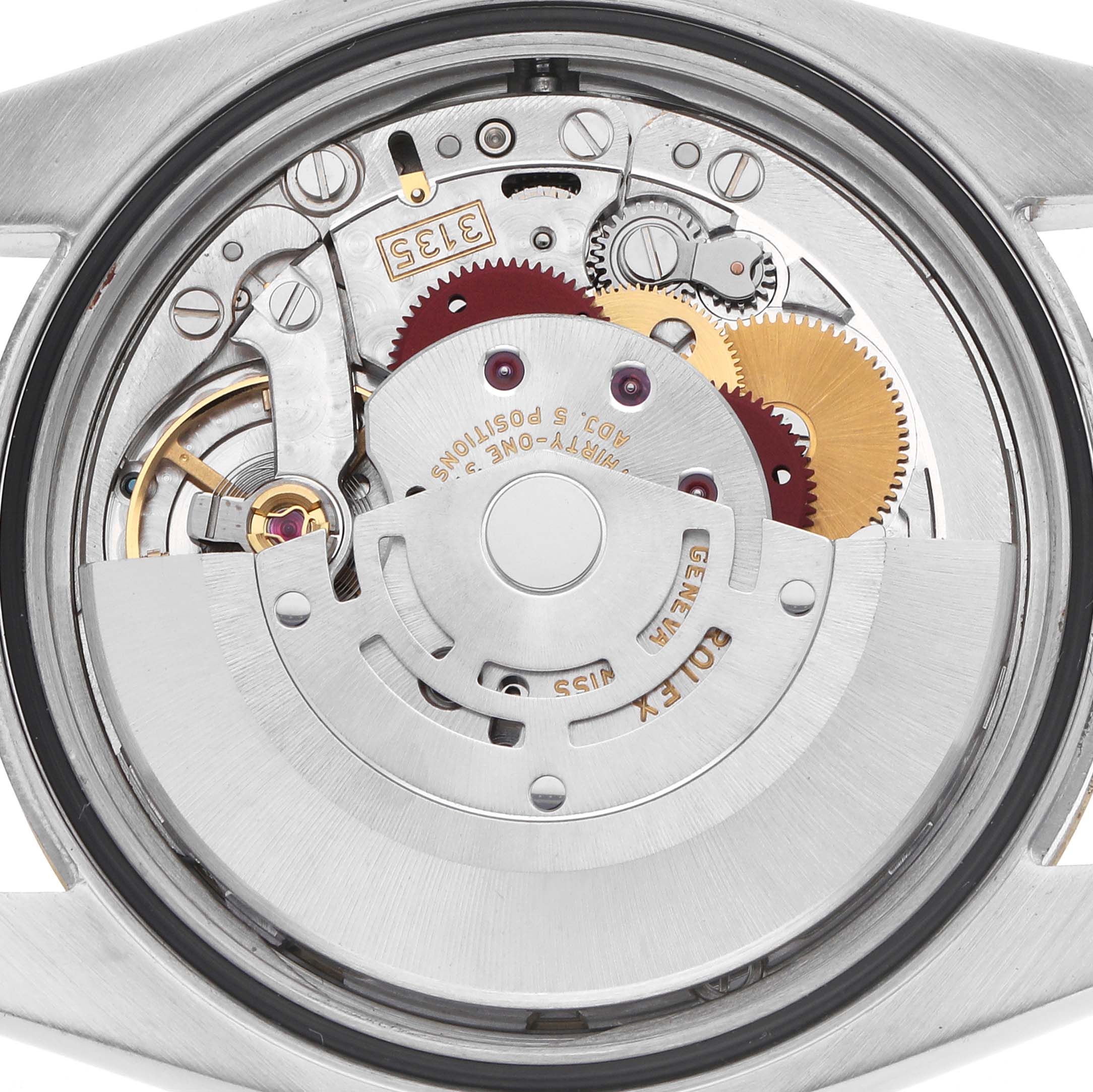 The image shows the movement of a Rolex Datejust model, model number 116233, from the back, highlighting gears and the oscillating rotor.
