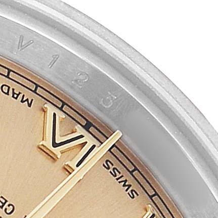 The image shows a close-up of the Rolex Datejust 179173 Women's Steel and Gold (two tone) Champagne Dial dial, highlighting the VI marker and part of the bezel.