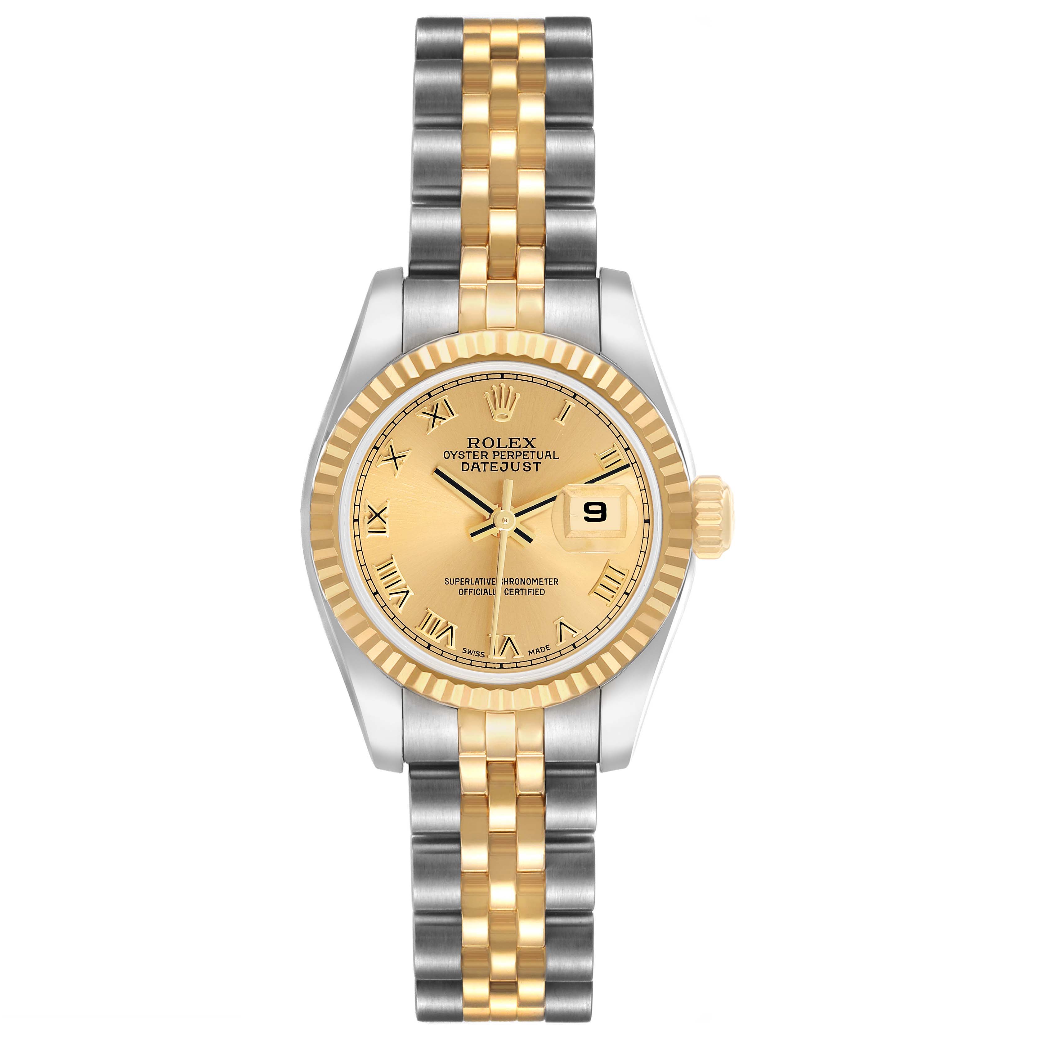 The Rolex Datejust 179173 Women's Steel and Gold (two tone) Champagne Dial watch is shown from a top view, highlighting its gold and silver case, dial, and bracelet.