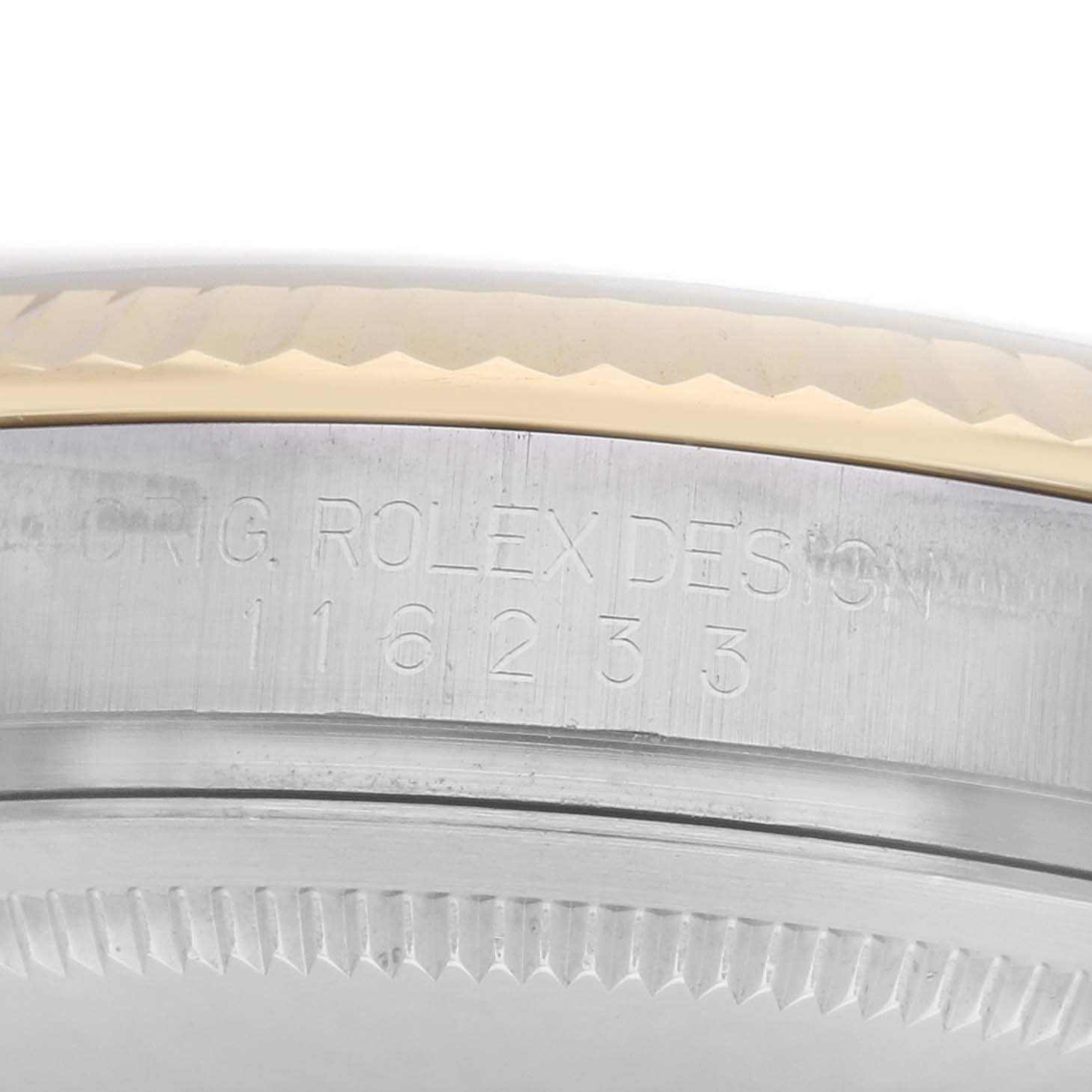 The image shows a close-up of the side engraving on the case of a Rolex Datejust men
s watch, model 116233, highlighting the model number and part of the bezel.