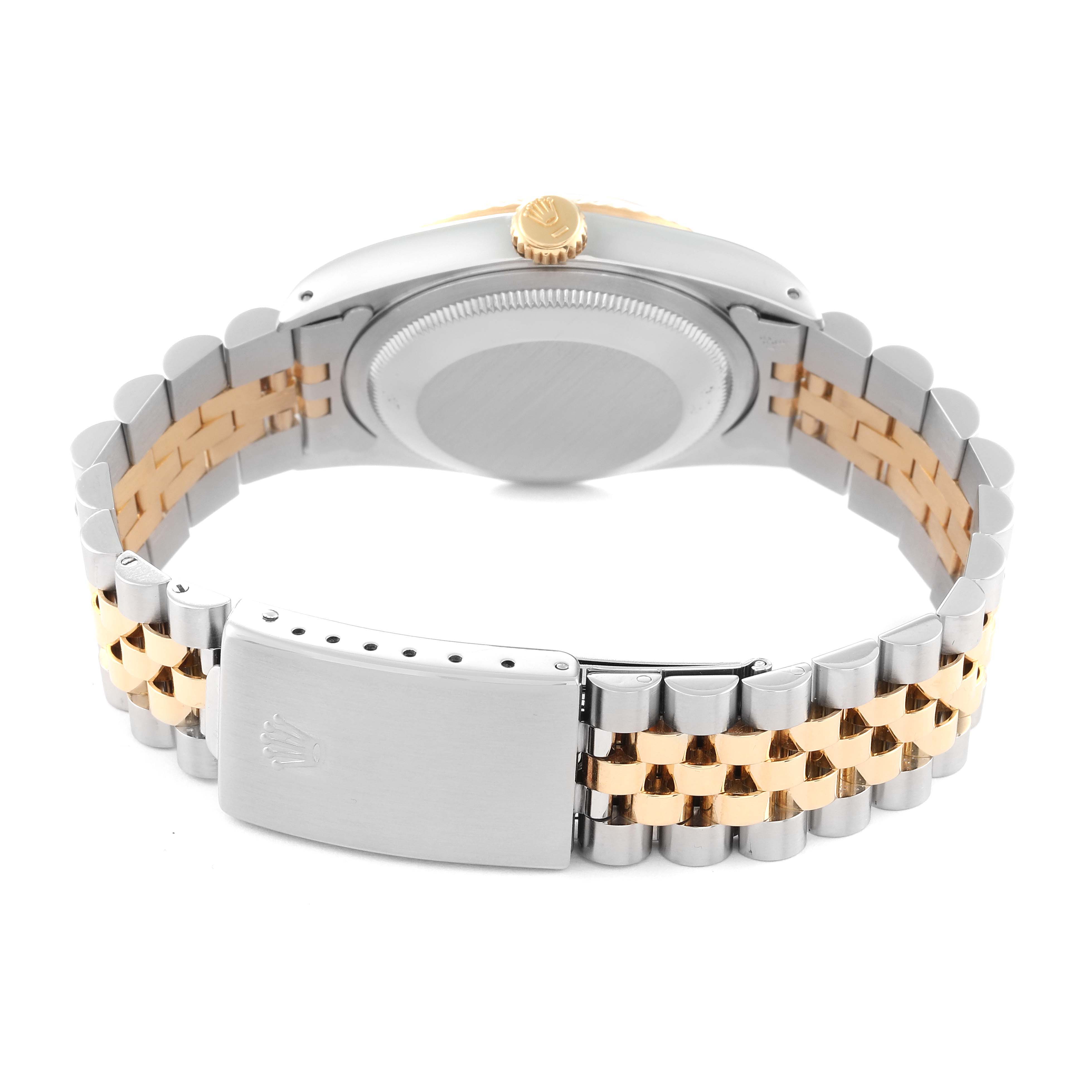 The image shows the backside of a Rolex Datejust 16233 Men's Steel and Gold (two tone) Silver Dial 16233 Men's Steel and Gold (two tone) Silver Dial watch, highlighting its clasp, case back, and two-tone bracelet.