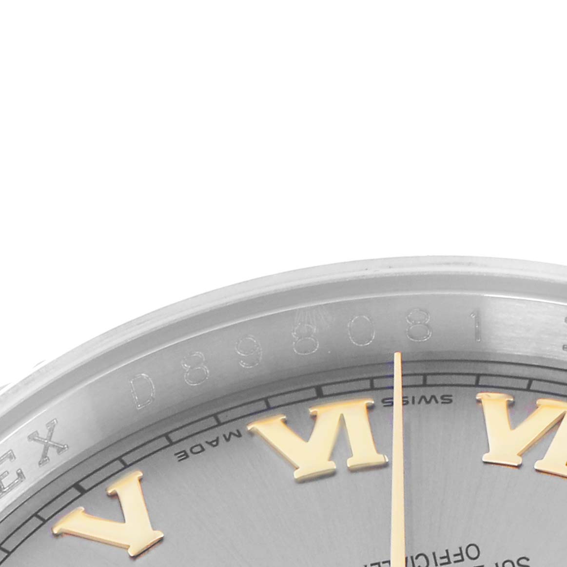The image shows a partial close-up of the Rolex Datejust model 116233 watch, highlighting the edge of the dial and gold Roman numerals.