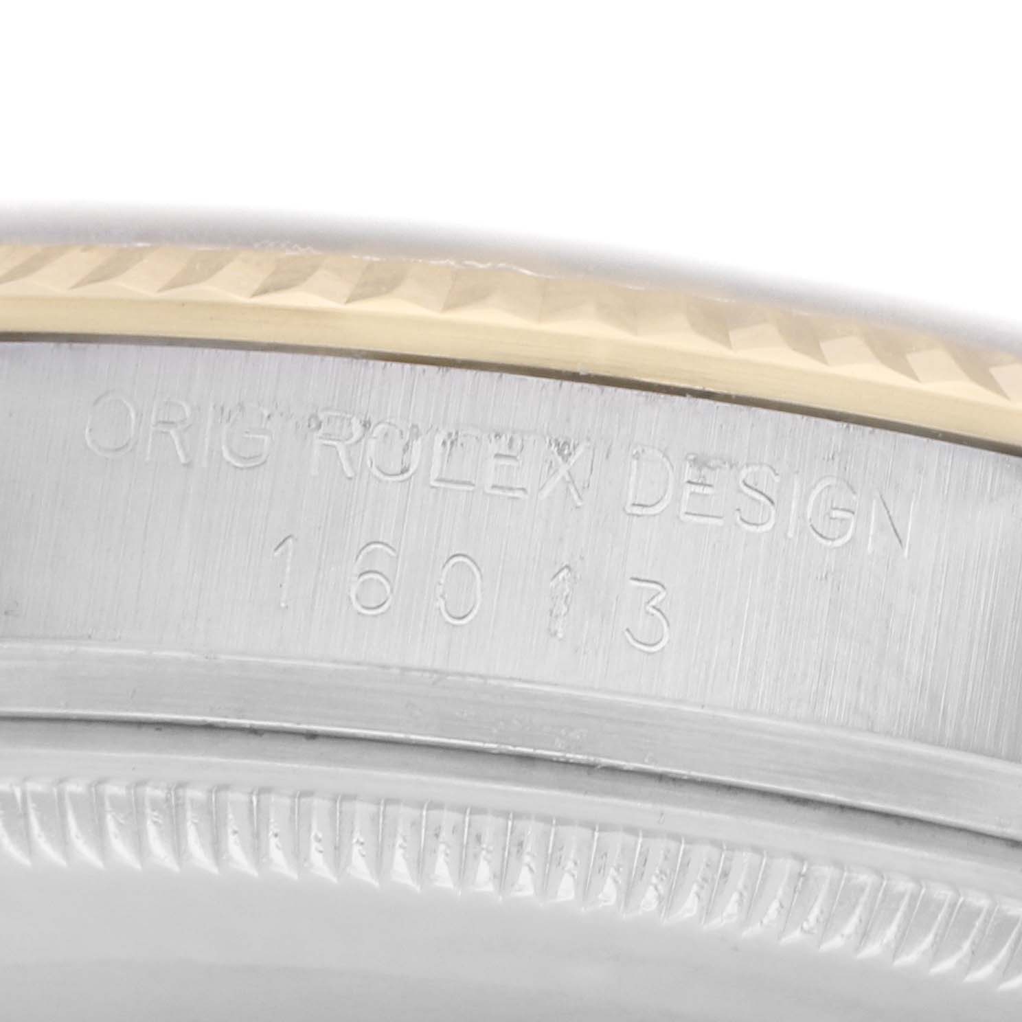 The image shows a close-up of the side of a Rolex Datejust model 16013, focusing on the engraved model number and design details on the case.