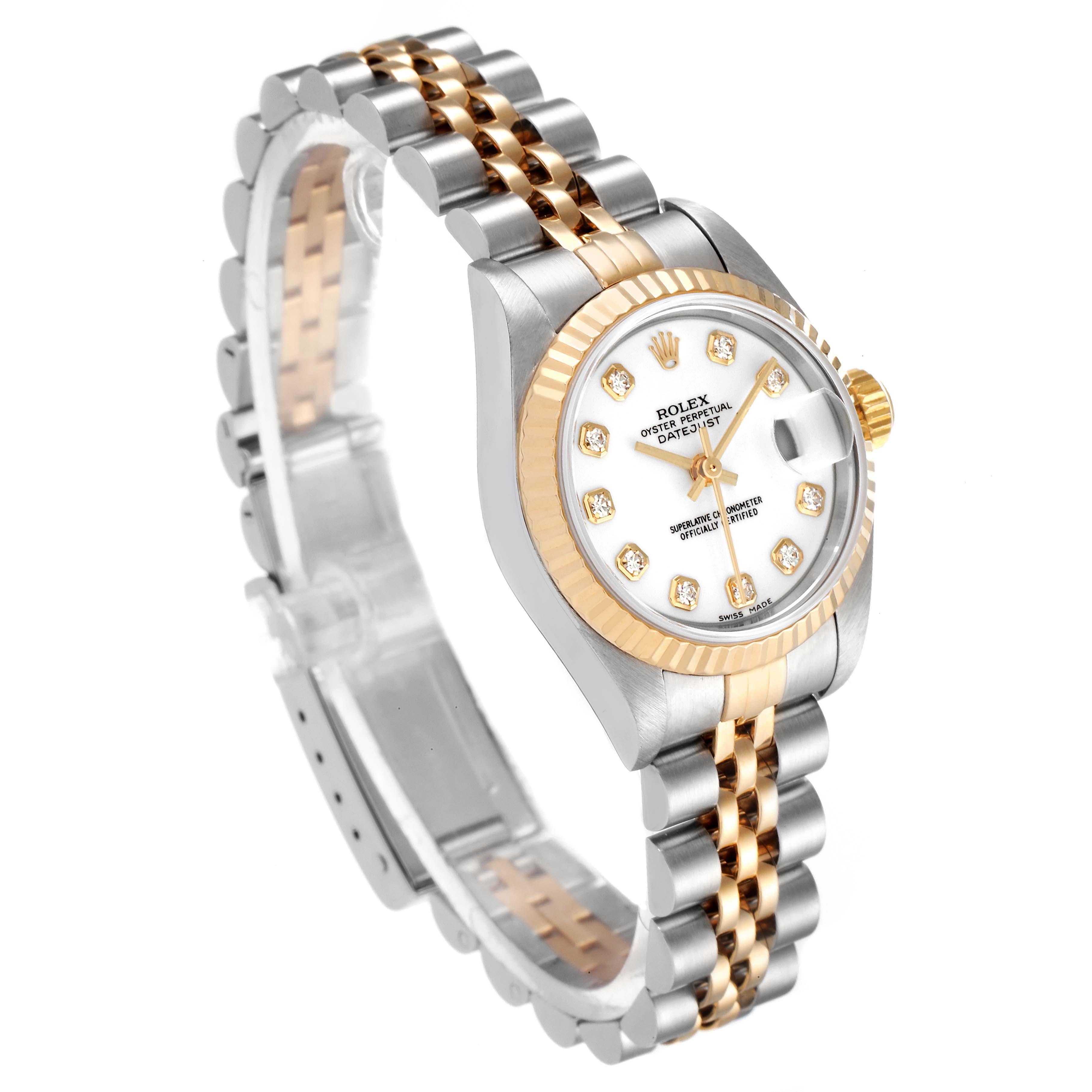 The image shows a Rolex Datejust 79173 Women
s Steel and Gold (two tone) White Dial 79173 Women
s Steel and Gold (two tone) White Dial watch at a three-quarter angle, highlighting the face, bezel, and two-tone bracelet.