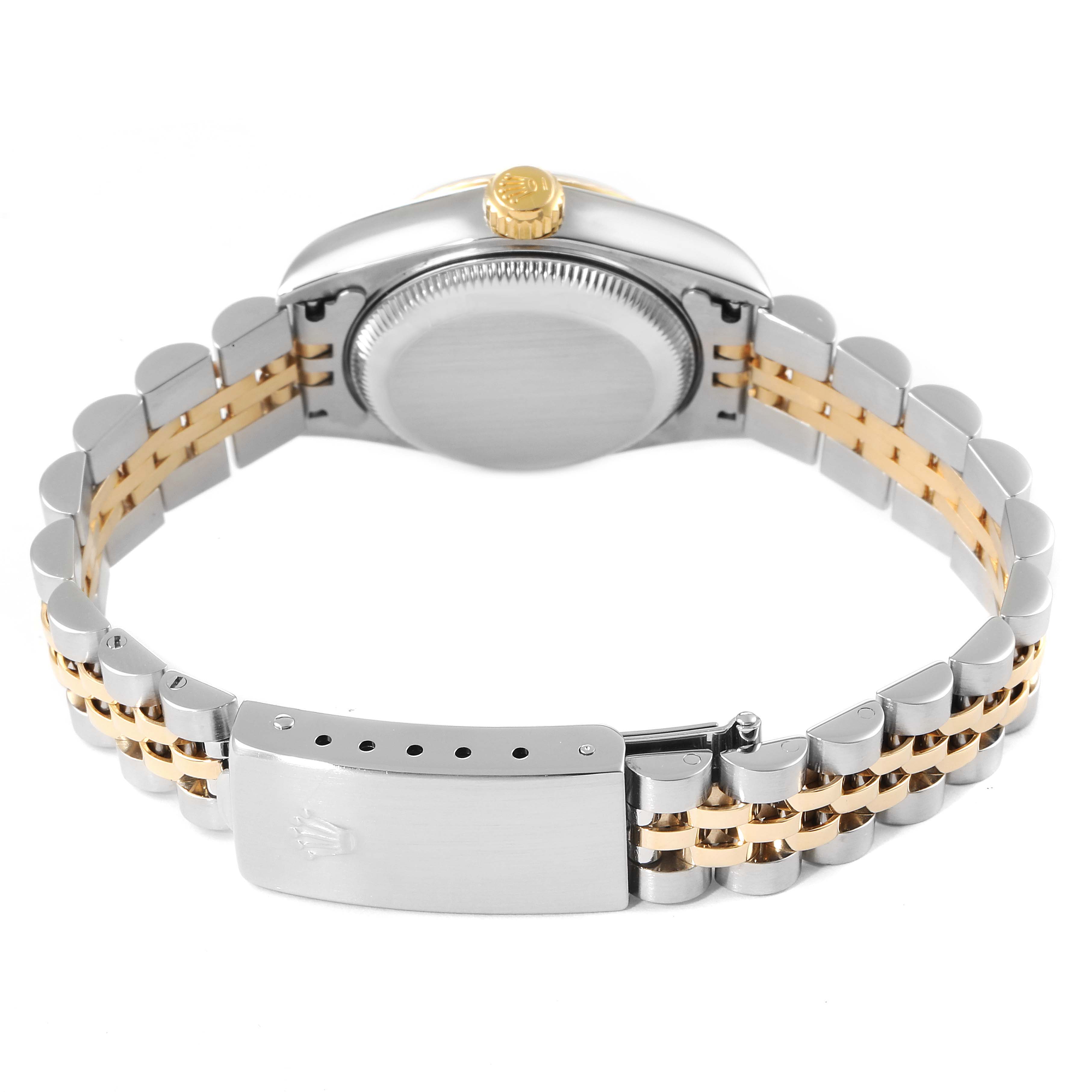 The image shows the back view of a Rolex Datejust 79173 Women
s Steel and Gold (two tone) White Dial 79173 Women
s Steel and Gold (two tone) White Dial watch, highlighting the case back, crown, and two-tone bracelet with a clasp.