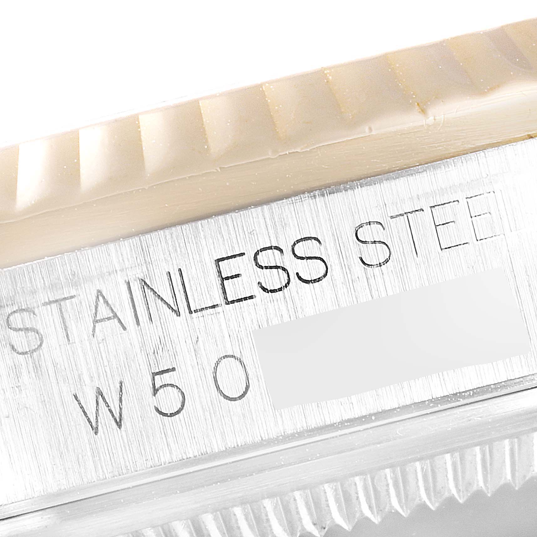 This close-up image shows the case and bezel of a Rolex Datejust 16233 Men
s Steel and Gold (two tone) White Dial 16233 Men
s Steel and Gold (two tone) White Dial watch, highlighting its stainless steel material.