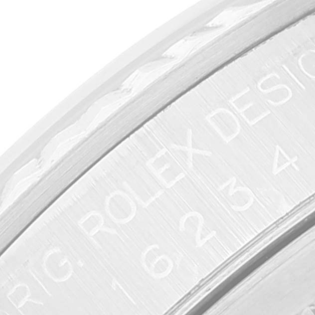 This close-up shows part of the engraved bezel edge of the Rolex Datejust 16234 Men's Stainless Steel White Dial 16234 Men's Stainless Steel White Dial watch.