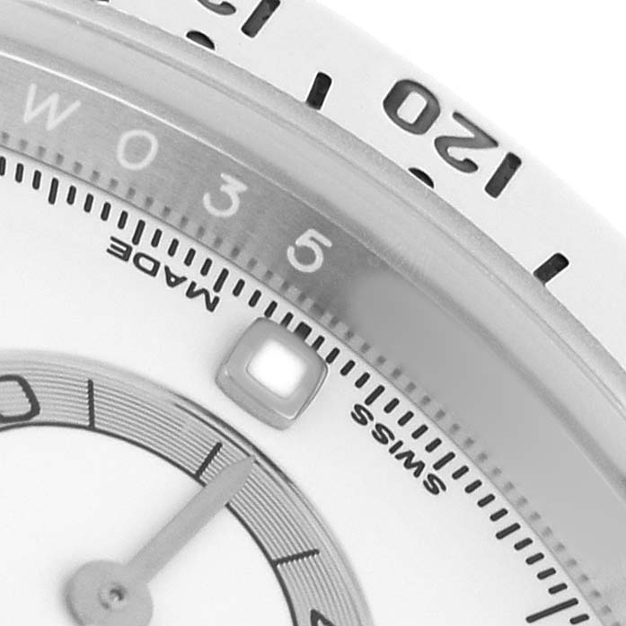 The image shows a close-up of the dial and bezel of a Rolex Daytona 116520 Men's Stainless Steel White Dial, highlighting the tachymetric scale and hour marker.