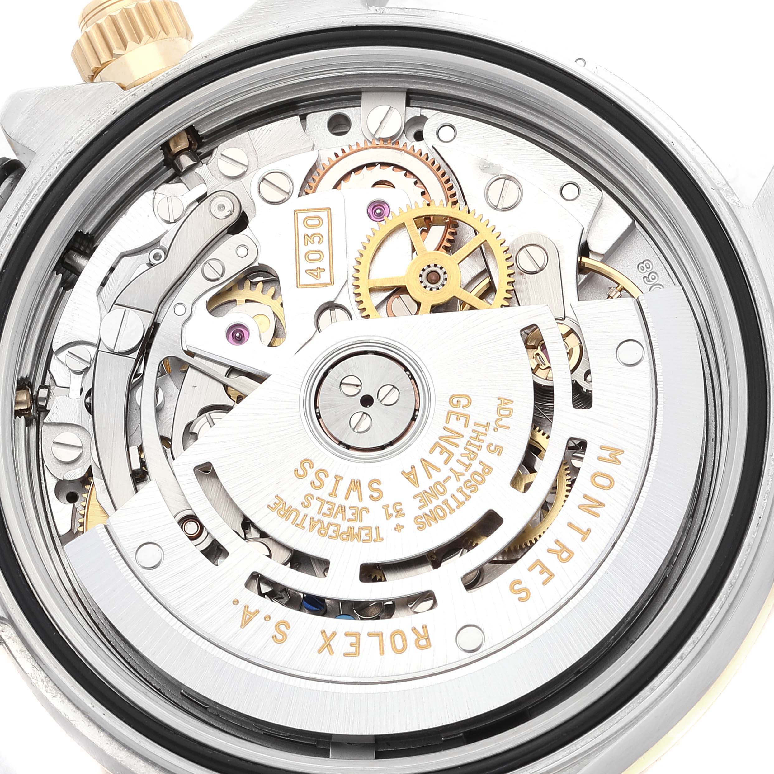 The image shows the movement and internal components of a Rolex Daytona 16523 Men's Steel and Gold (two tone) White Dial 16523 Men's Steel and Gold (two tone) White Dial watch from a top-down angle.