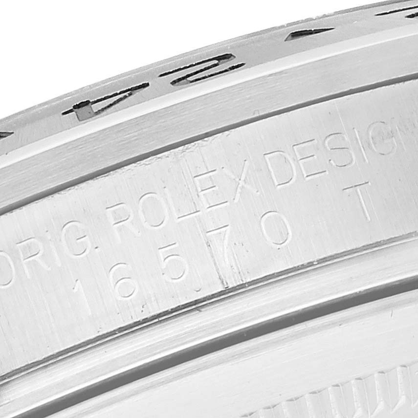This close-up image shows the side view of the bezel and engraved details of a Rolex Explorer 16570 Men
s Stainless Steel Black Dial 16570 Men
s Stainless Steel Black Dial model.