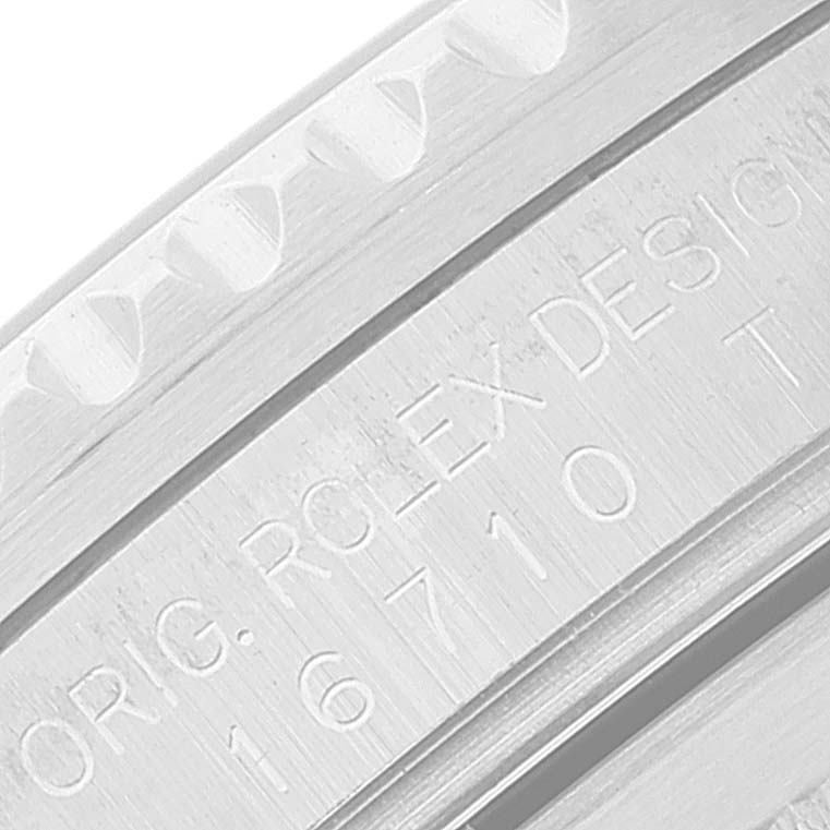 This close-up image shows the engraved reference number and design details on the case side of a Rolex GMT-Master 16710 Men
s Stainless Steel Black Dial 16710 Men
s Stainless Steel Black Dial watch.
