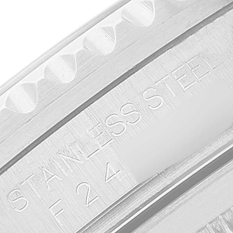 This close-up image shows the side engraving of a Rolex GMT-Master 16710 Men
s Stainless Steel Black Dial 16710 Men
s Stainless Steel Black Dial watch indicating "STAINLESS STEEL."