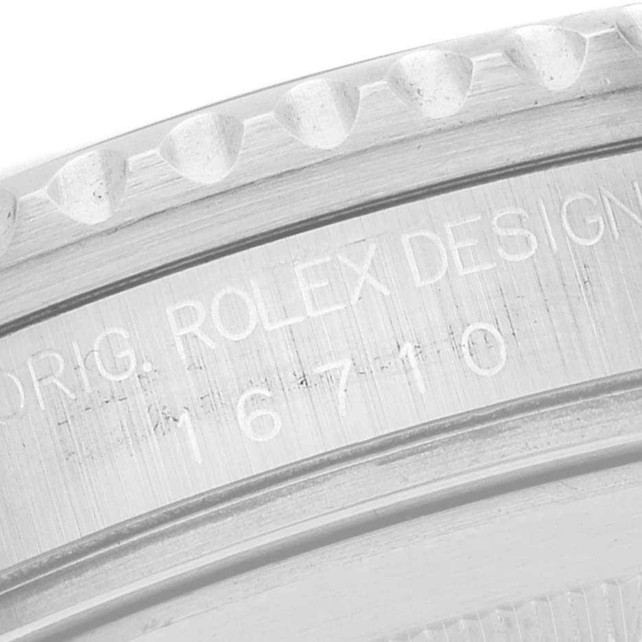 The image shows a close-up view of the case side engraving on a Rolex GMT-Master 16710 Men
s Stainless Steel Black Dial 16710 Men
s Stainless Steel Black Dial watch, displaying the model number 16710.