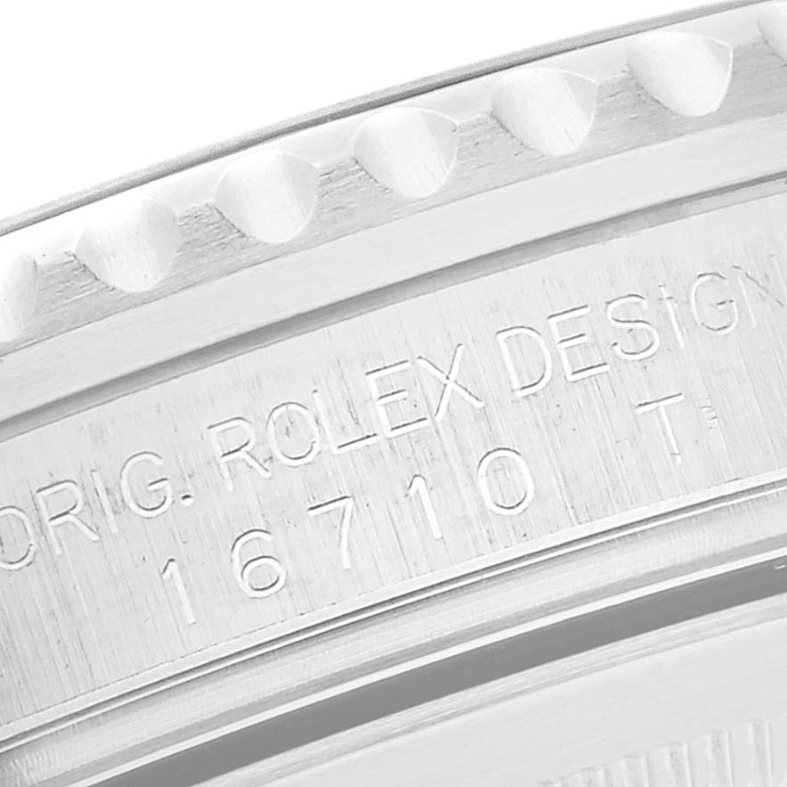 This close-up image shows engraved details on the case side of a Rolex GMT-Master 16710 Men's Stainless Steel Black Dial 16710 Men's Stainless Steel Black Dial with model number 16710.