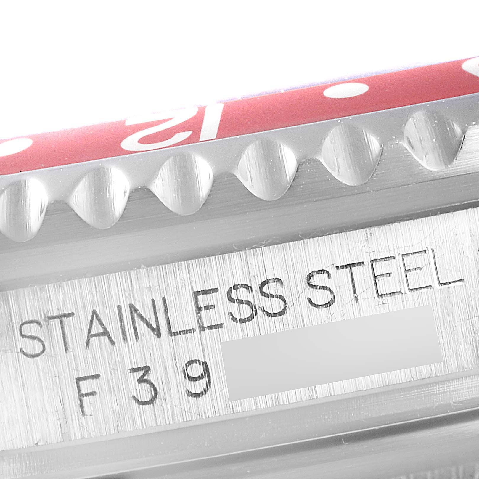 This close-up image shows the bezel and part of the serial number of a stainless steel Rolex GMT-Master 16710 Men
s Stainless Steel Black Dial 16710 Men
s Stainless Steel Black Dial watch.