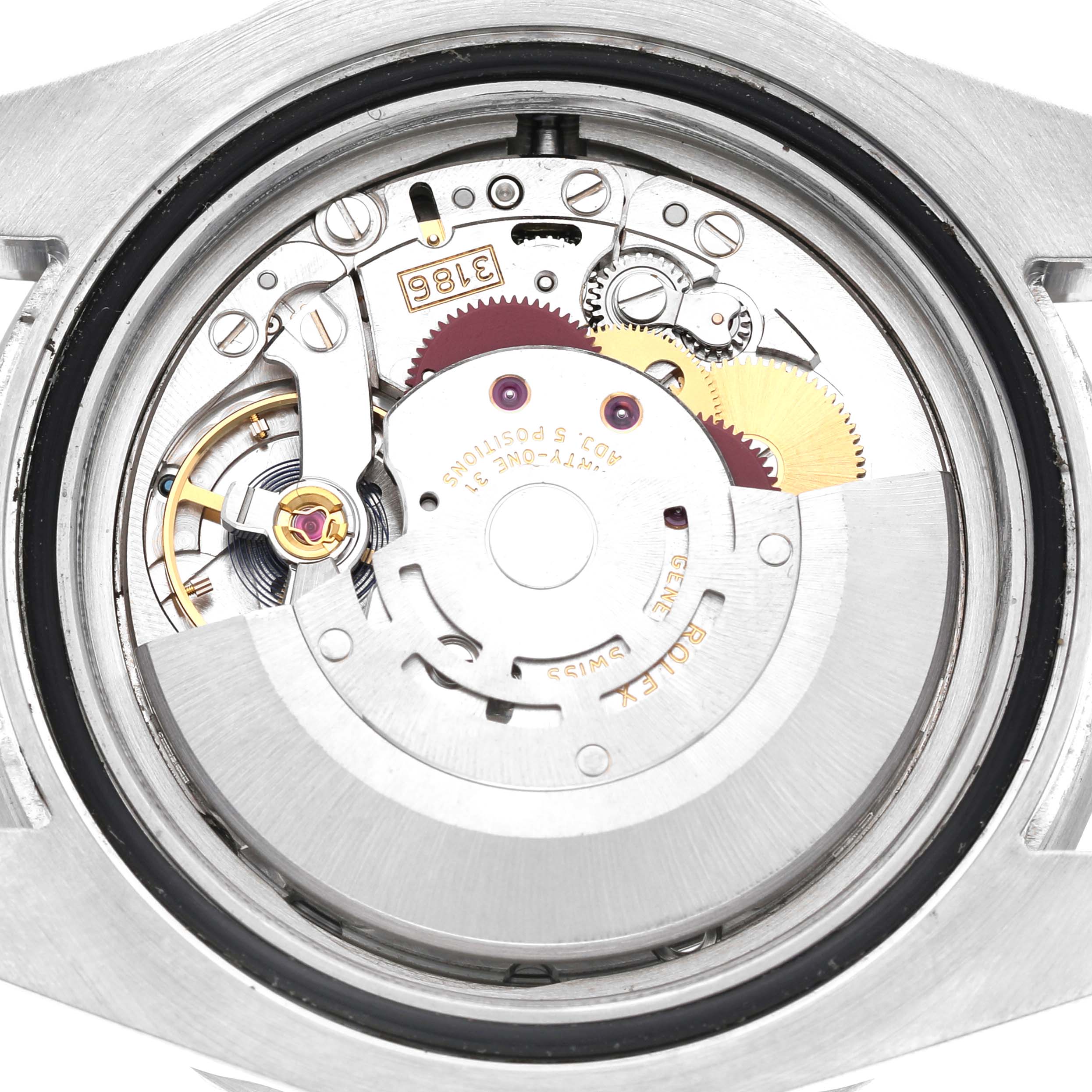 The image shows the movement mechanism of a Rolex GMT-Master 116710 Men's Stainless Steel Black Dial watch from a top-down angle, highlighting its intricate components.