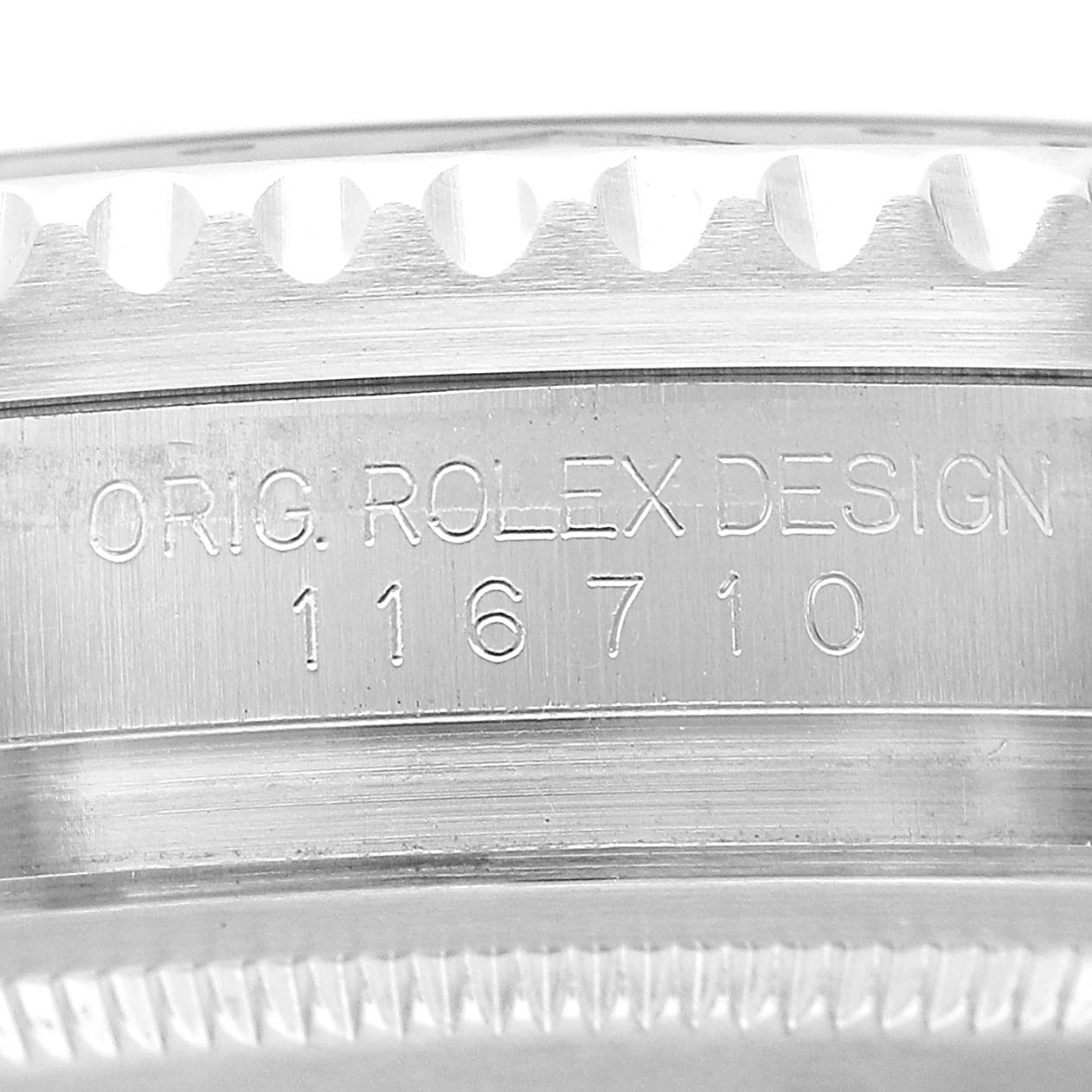 The image shows a close-up of the side of a Rolex GMT-Master 116710 Men's Stainless Steel Black Dial, highlighting the model number "116710" and "ORIG. ROLEX DESIGN" engraving.
