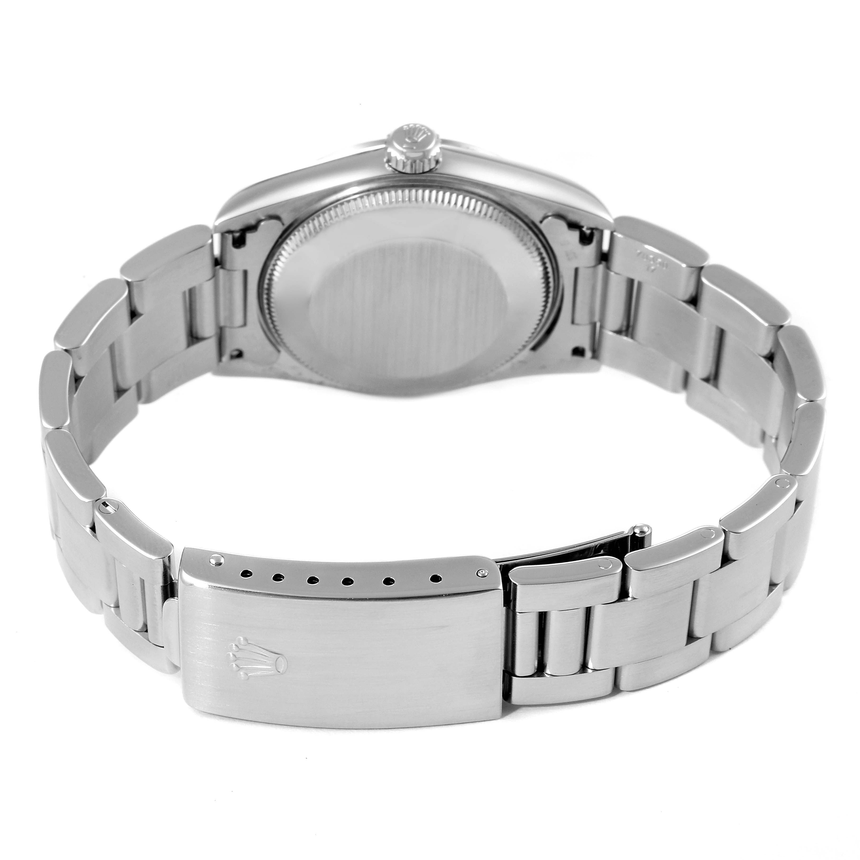 This image shows the back view of the Rolex Mid-Size 77080 Women
s Stainless Steel White Dial 77080 Women
s Stainless Steel White Dial model, focusing on the case back and metal bracelet clasp.