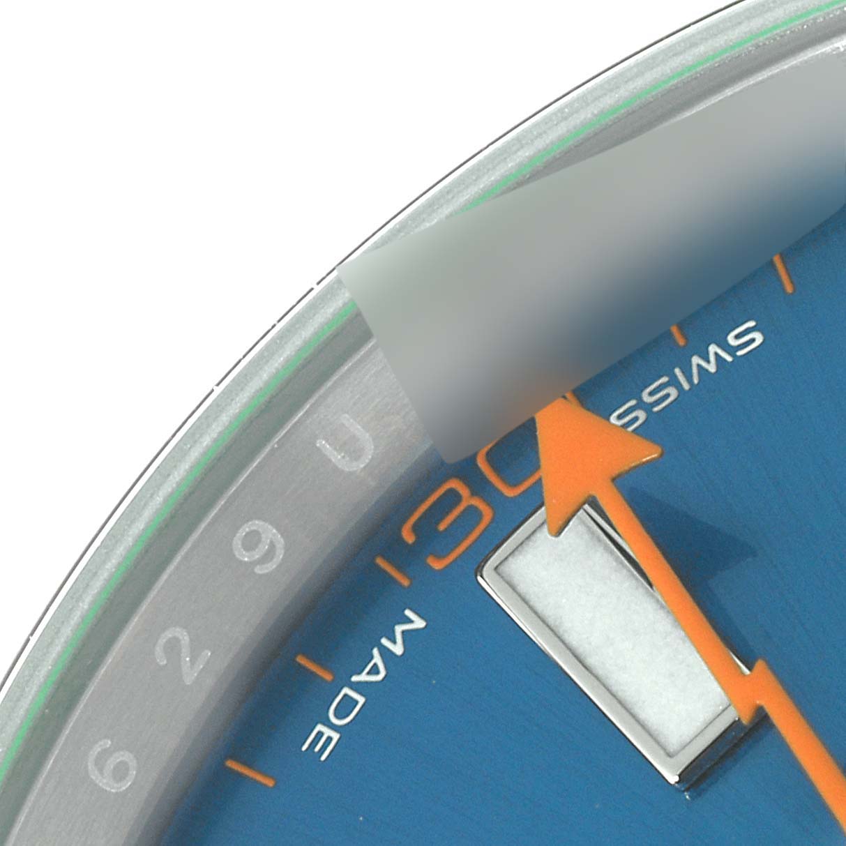The image shows a close-up of the dial and part of the seconds hand of the Rolex Milgauss 116400GV Men
s Stainless Steel Blue Dial 116400GV Men
s Stainless Steel Blue Dial, including hour markers and "Swiss Made" text.