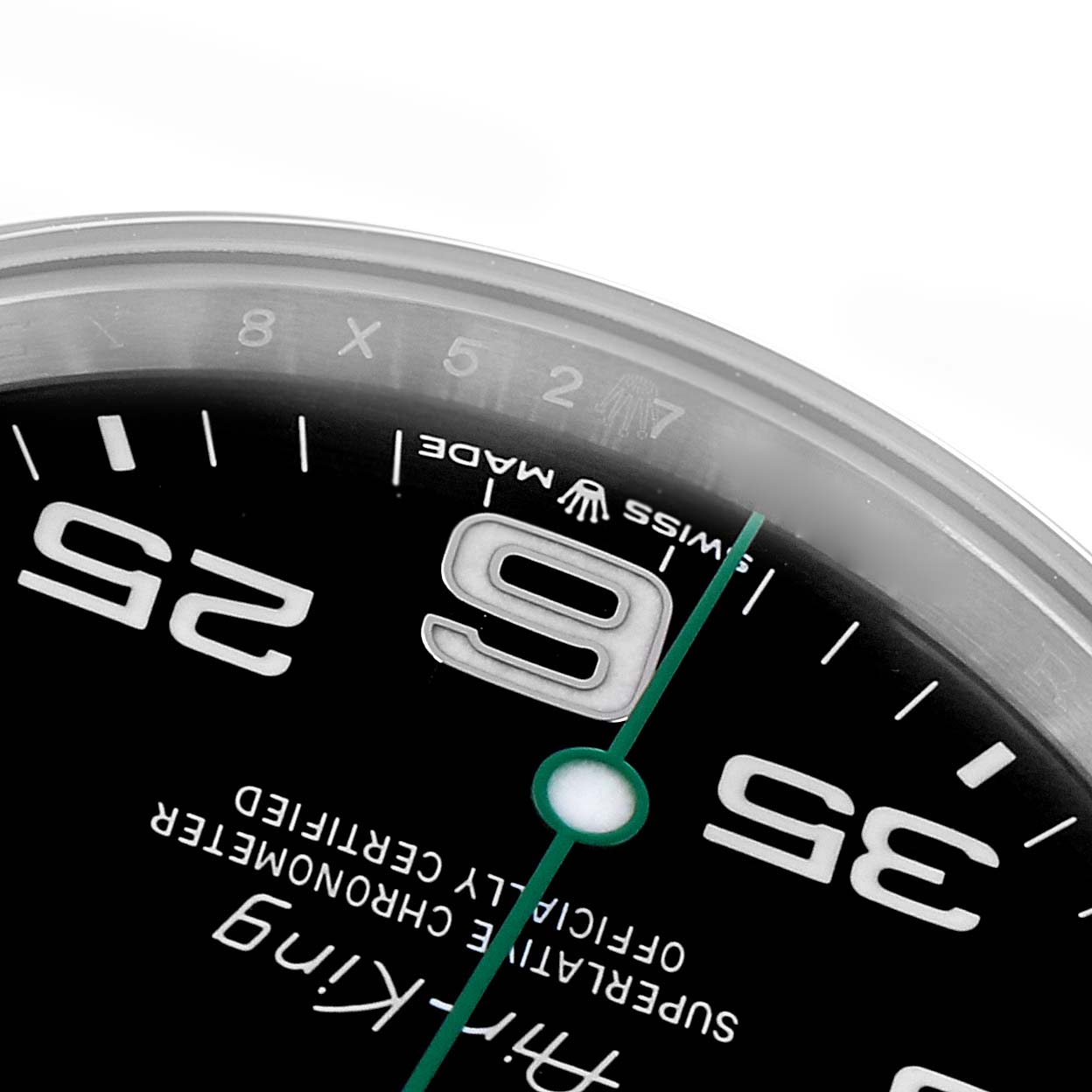 The image shows a close-up of the Rolex Air-King model 126900 watch, focusing on its dial with numbers "9" and "25," and the "Swiss Made" text.