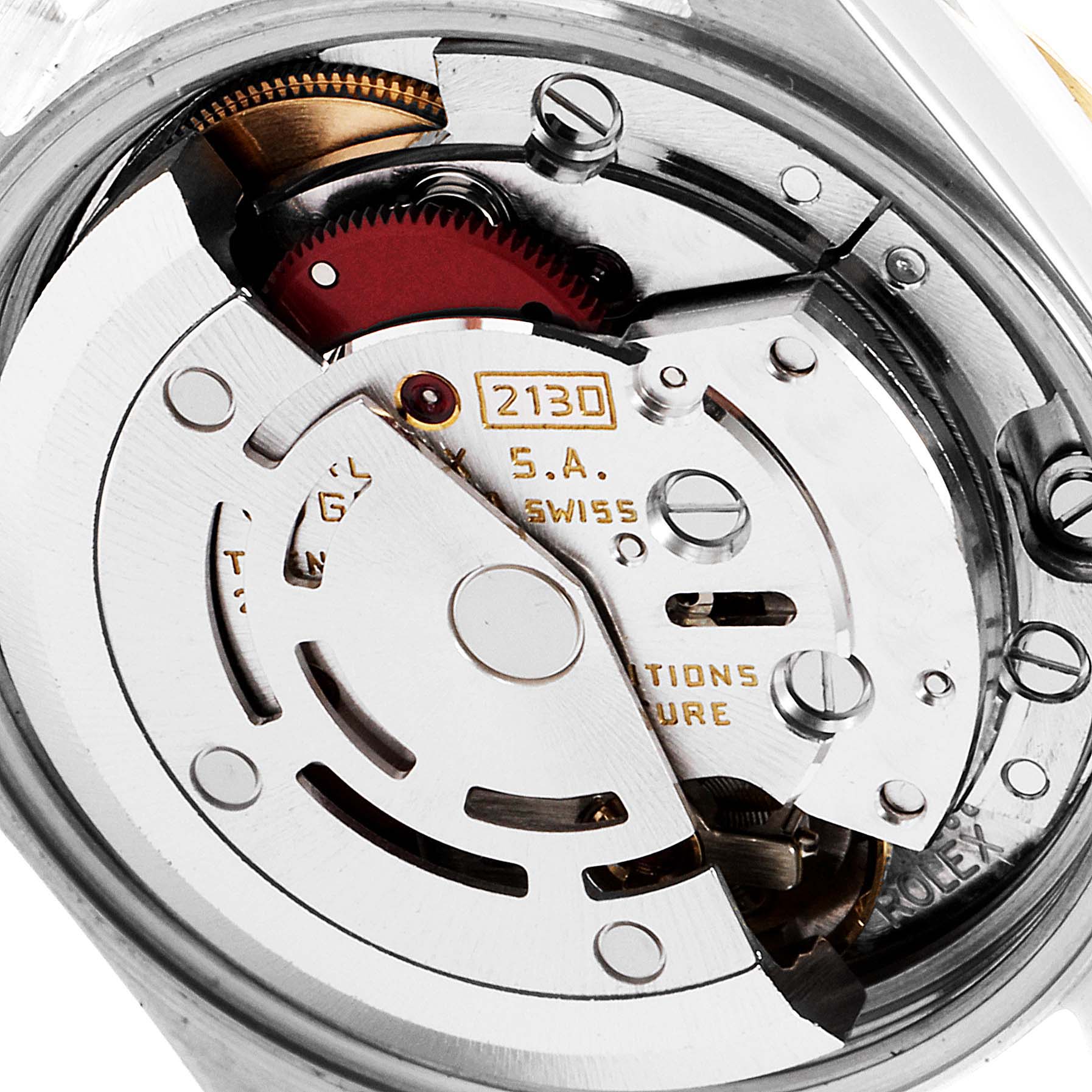 This image shows a close-up view of the movement and inner workings of a Rolex Oyster Perpetual 67193 Women
s Steel and Gold (two tone) Champagne Dial 67193 Women
s Steel and Gold (two tone) Champagne Dial watch.