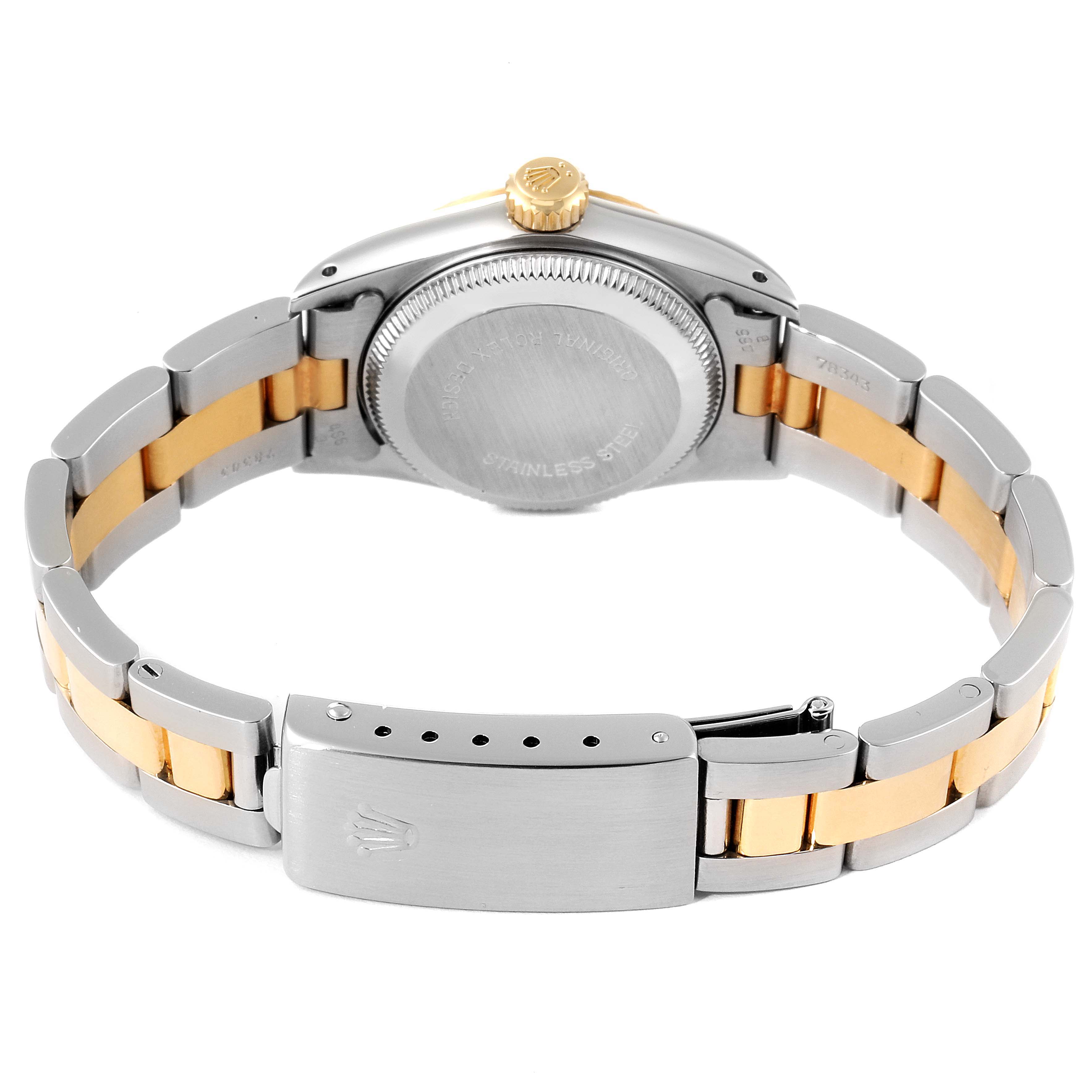 The image shows the back view of the Rolex Oyster Perpetual 67193 Women
s Steel and Gold (two tone) Champagne Dial 67193 Women
s Steel and Gold (two tone) Champagne Dial watch, including the case back, crown, and part of the bracelet.