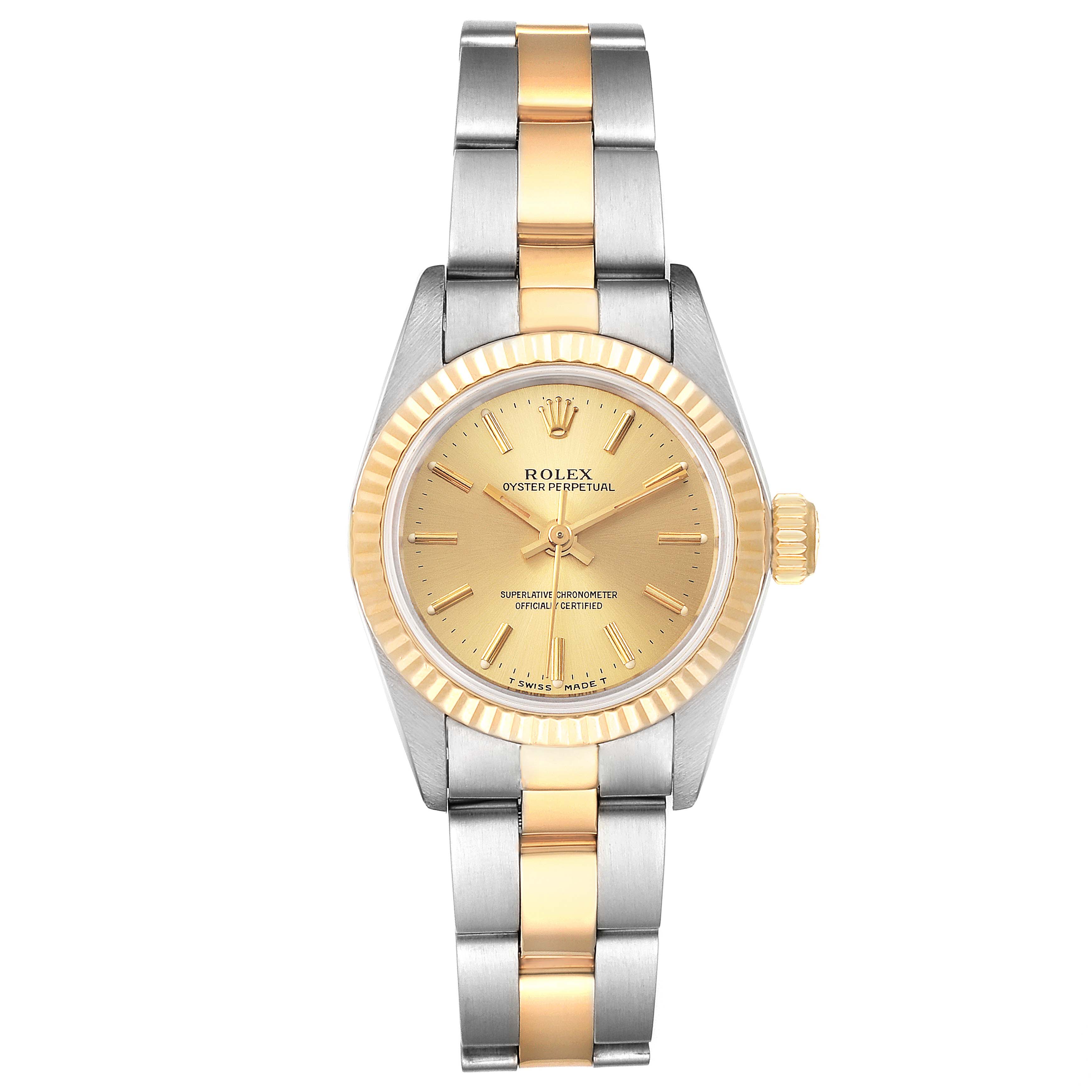This Rolex Oyster Perpetual 67193 Women
s Steel and Gold (two tone) Champagne Dial 67193 Women
s Steel and Gold (two tone) Champagne Dial watch is shown from a front angle, displaying its dial, bezel, and two-tone bracelet.