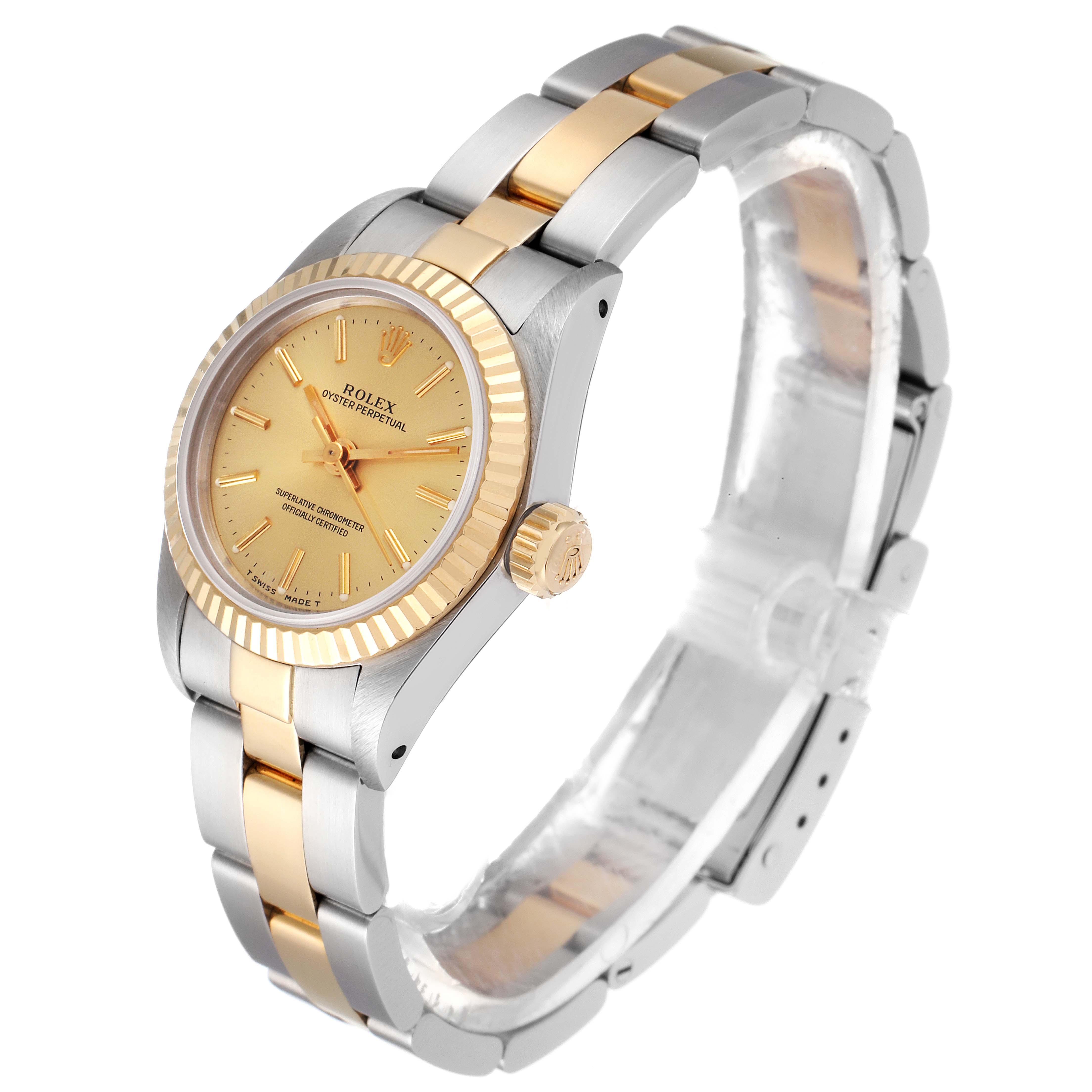 The Rolex Oyster Perpetual 67193 Women
s Steel and Gold (two tone) Champagne Dial 67193 Women
s Steel and Gold (two tone) Champagne Dial watch is shown at a slight angle, revealing its face, crown, and two-tone bracelet.