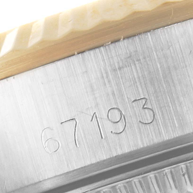 The image shows a close-up of the side of a Rolex Oyster Perpetual 67193 Women
s Steel and Gold (two tone) Champagne Dial 67193 Women
s Steel and Gold (two tone) Champagne Dial watch, highlighting the engraved model number "67193".