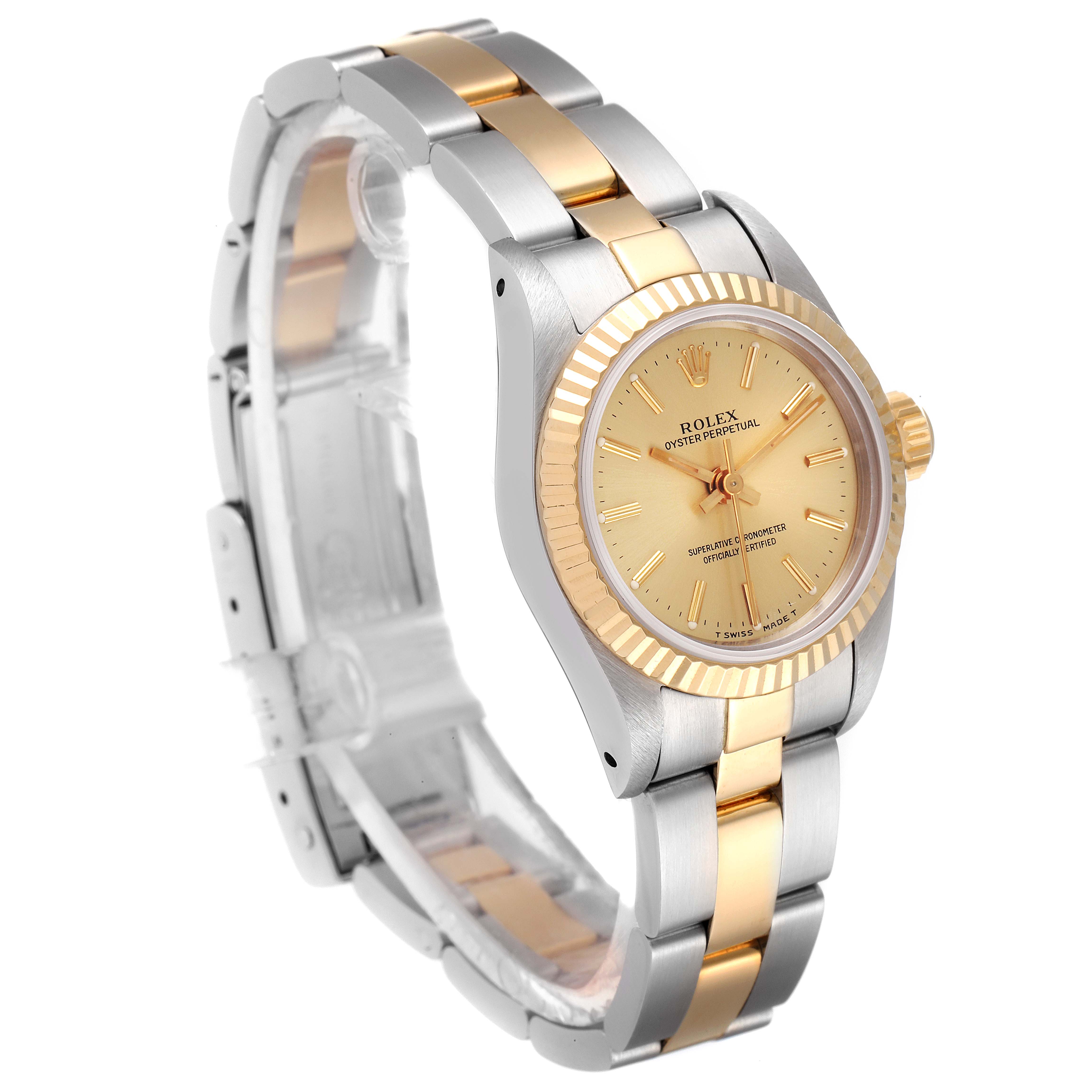 This image shows a Rolex Oyster Perpetual 67193 Women
s Steel and Gold (two tone) Champagne Dial 67193 Women
s Steel and Gold (two tone) Champagne Dial watch from a three-quarter angle, highlighting the dial, bezel, and two-tone bracelet.