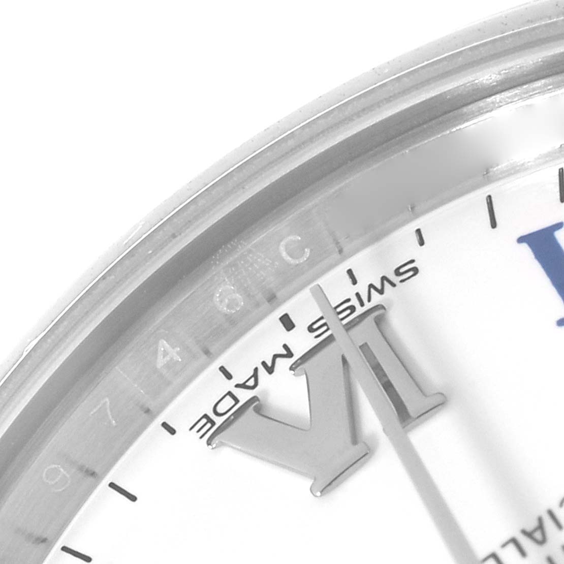 This image shows a close-up of the dial and bezel of a Rolex Mid-Size 177200 Women
s Stainless Steel White Dial 177200 Women
s Stainless Steel White Dial watch, highlighting the "VI" mark and "Swiss Made" text.