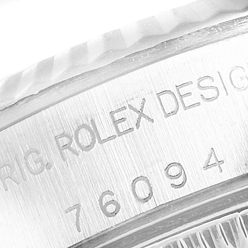 The image shows a close-up of the engraved model number on the case of a Rolex Oyster Perpetual 76094 Women
s Stainless Steel Black Dial 76094 Women
s Stainless Steel Black Dial watch.