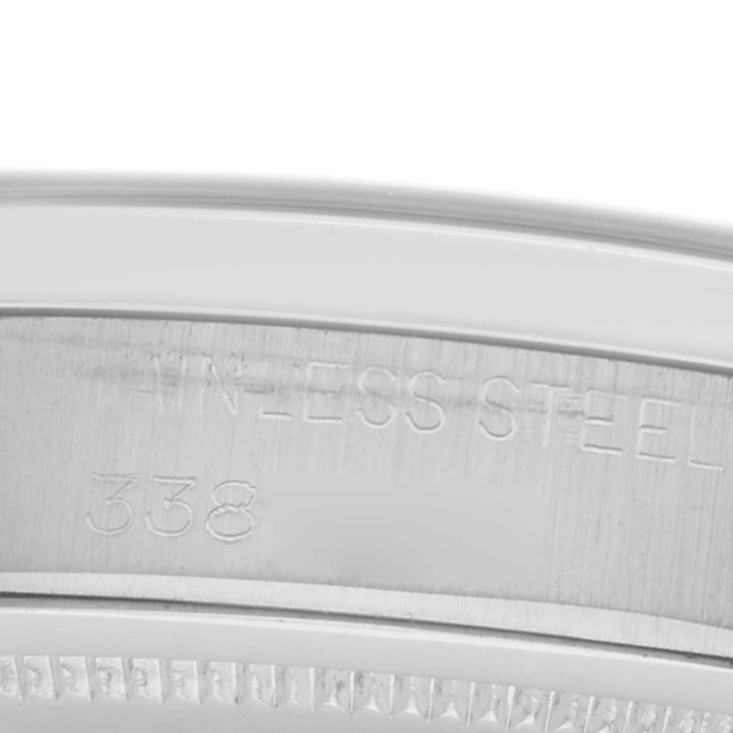 The image shows a close-up of the side of a Rolex Vintage Collection model 6426 watch, focusing on the stainless steel casing with engraved text.