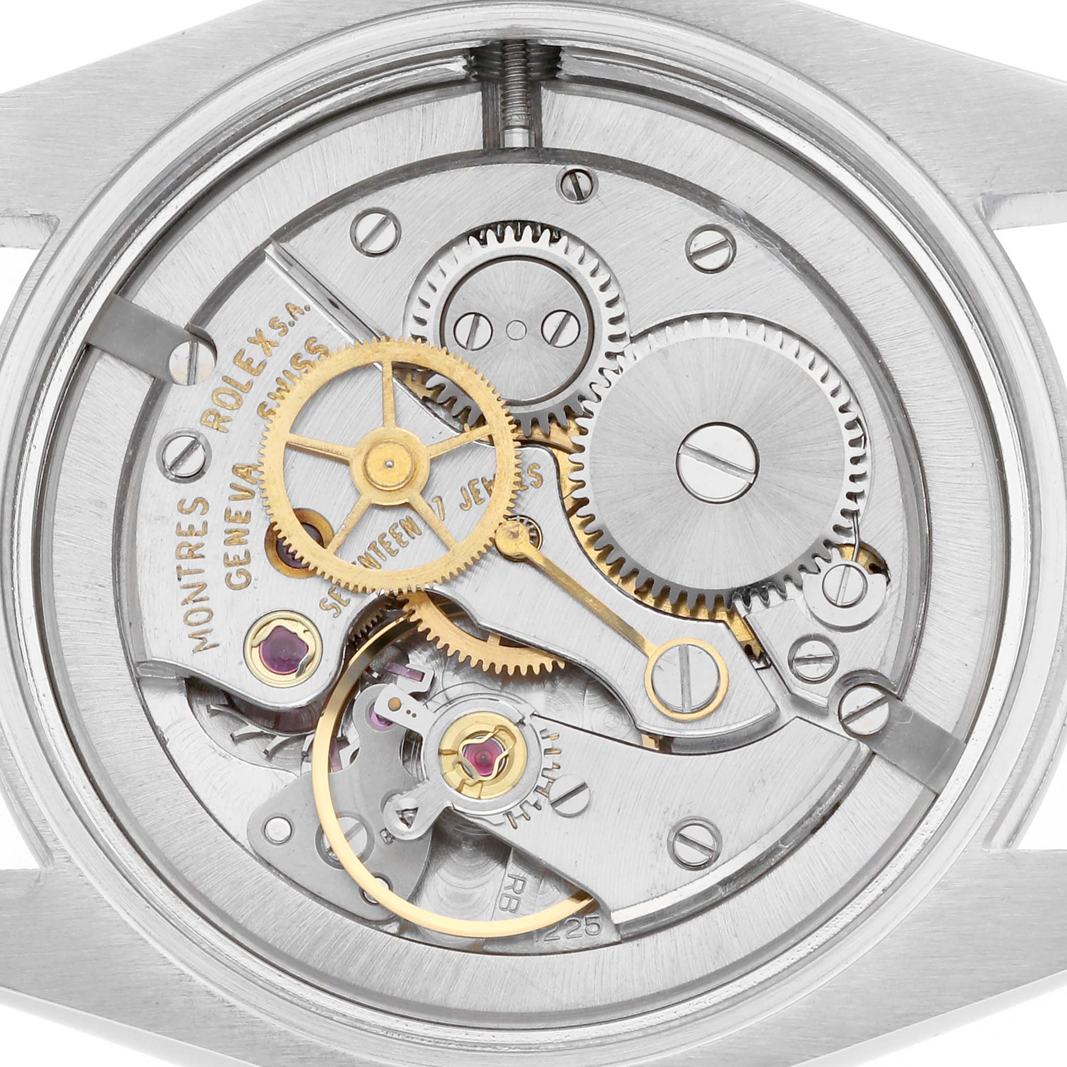 The image shows the internal mechanism of the Rolex Vintage Collection model 6426, highlighting gears, screws, and the intricate movement parts.