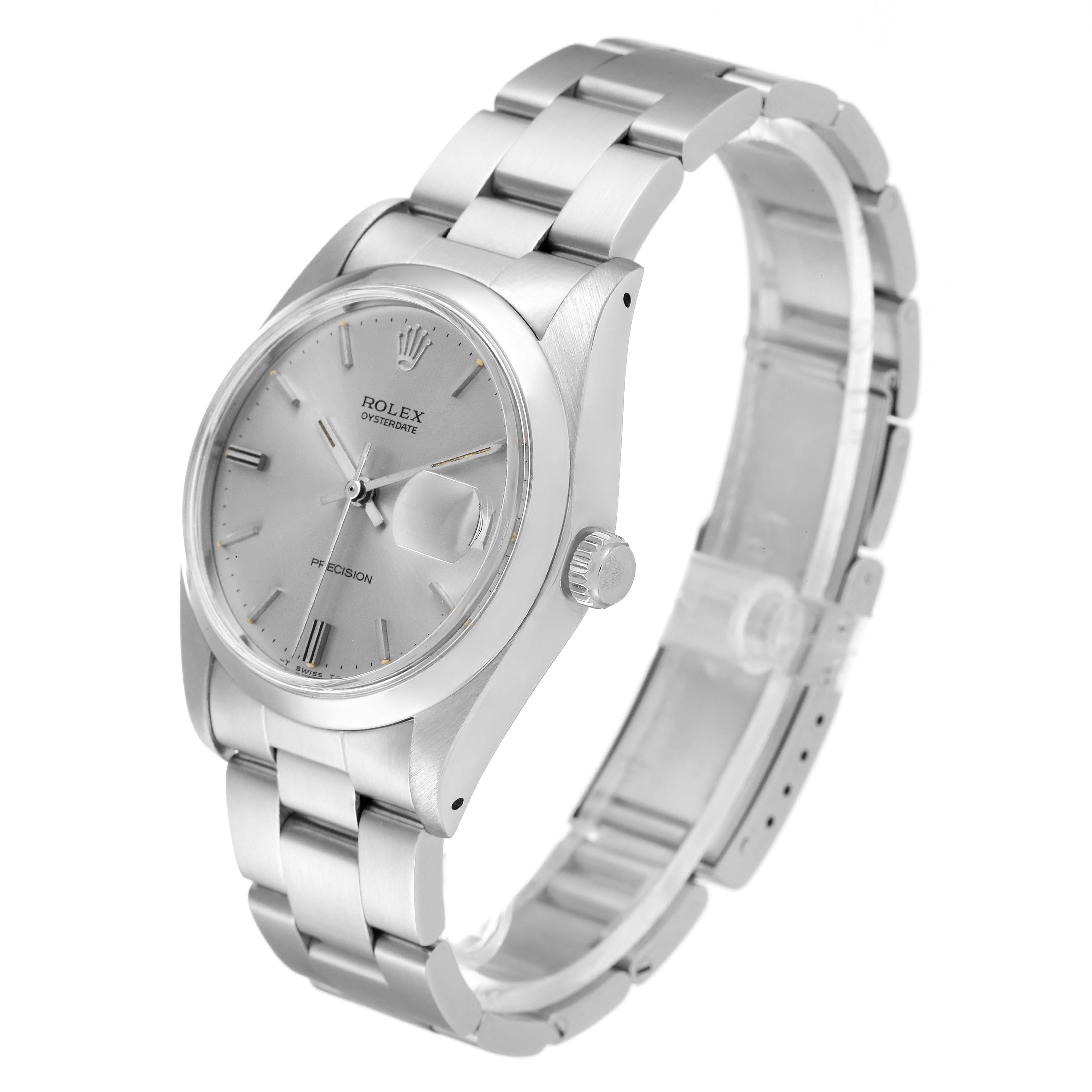 The Vintage Collection Rolex watch is shown at a three-quarter angle, displaying its face, crown, and stainless steel bracelet.