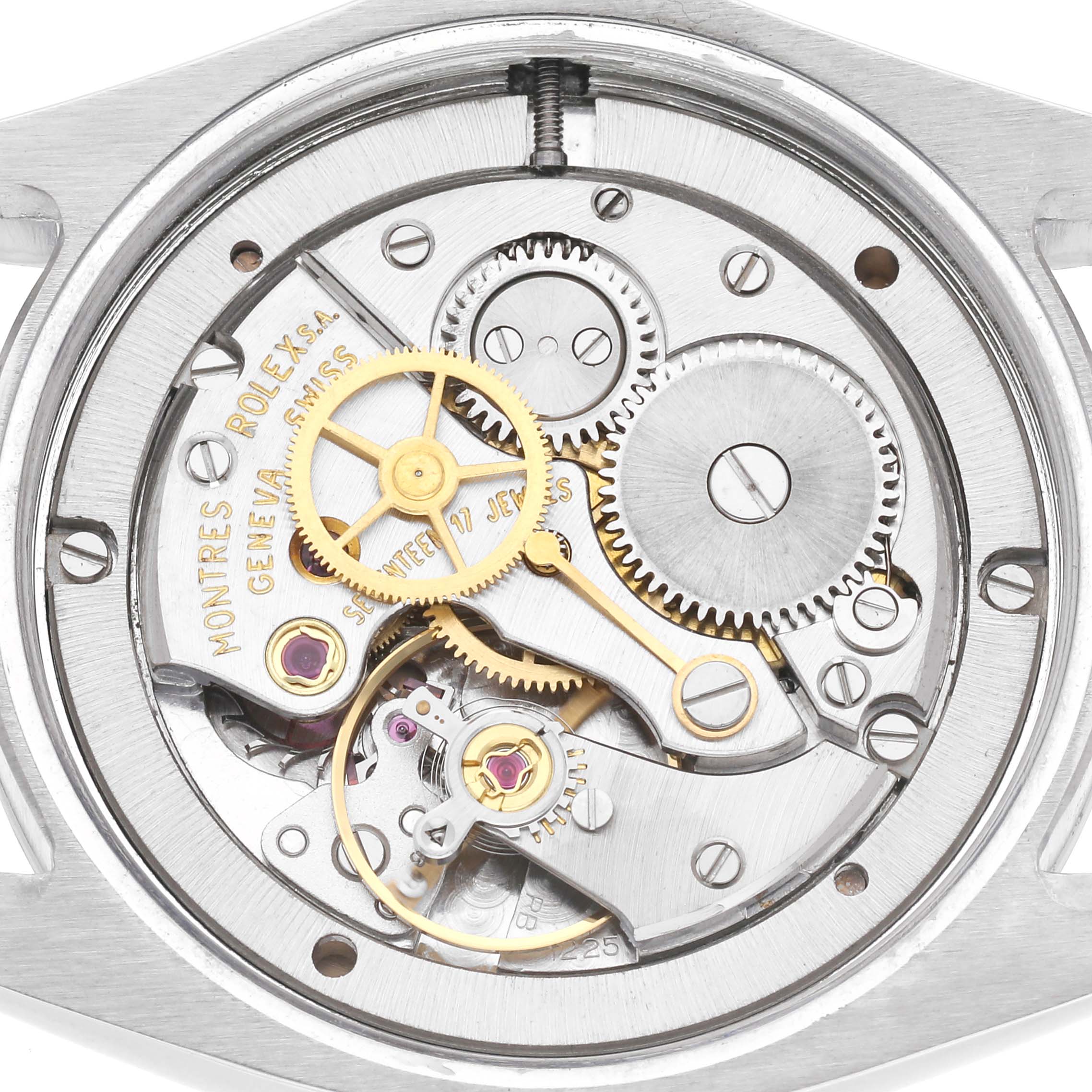 The image shows the movement of a Rolex Vintage Collection men
s watch, model number 6694, highlighting gears and internal mechanisms from a back view.